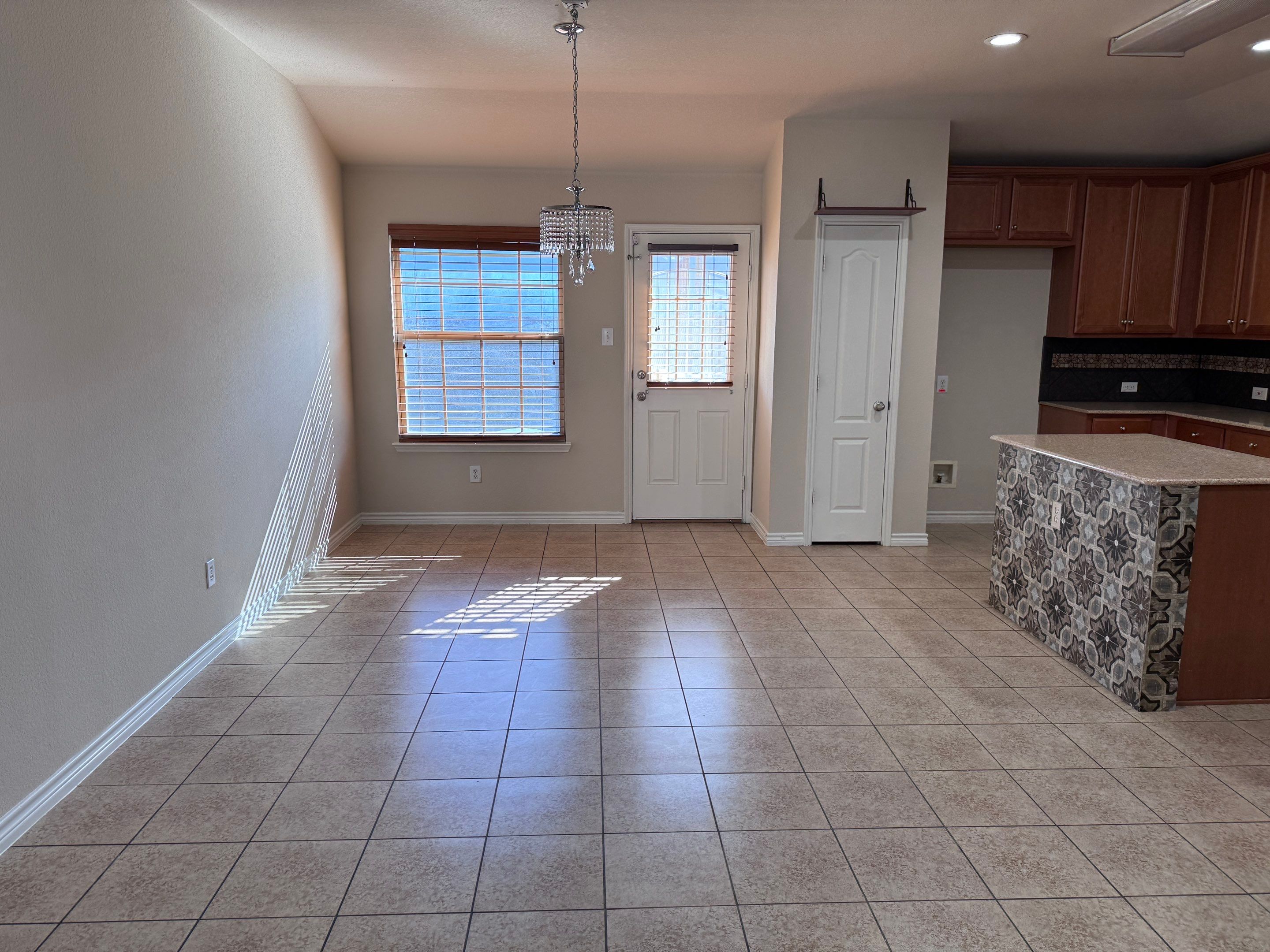 Luxury Focal Point: Full Kitchen Remodel with Double Waterfall Island by Tibi Soli LLC