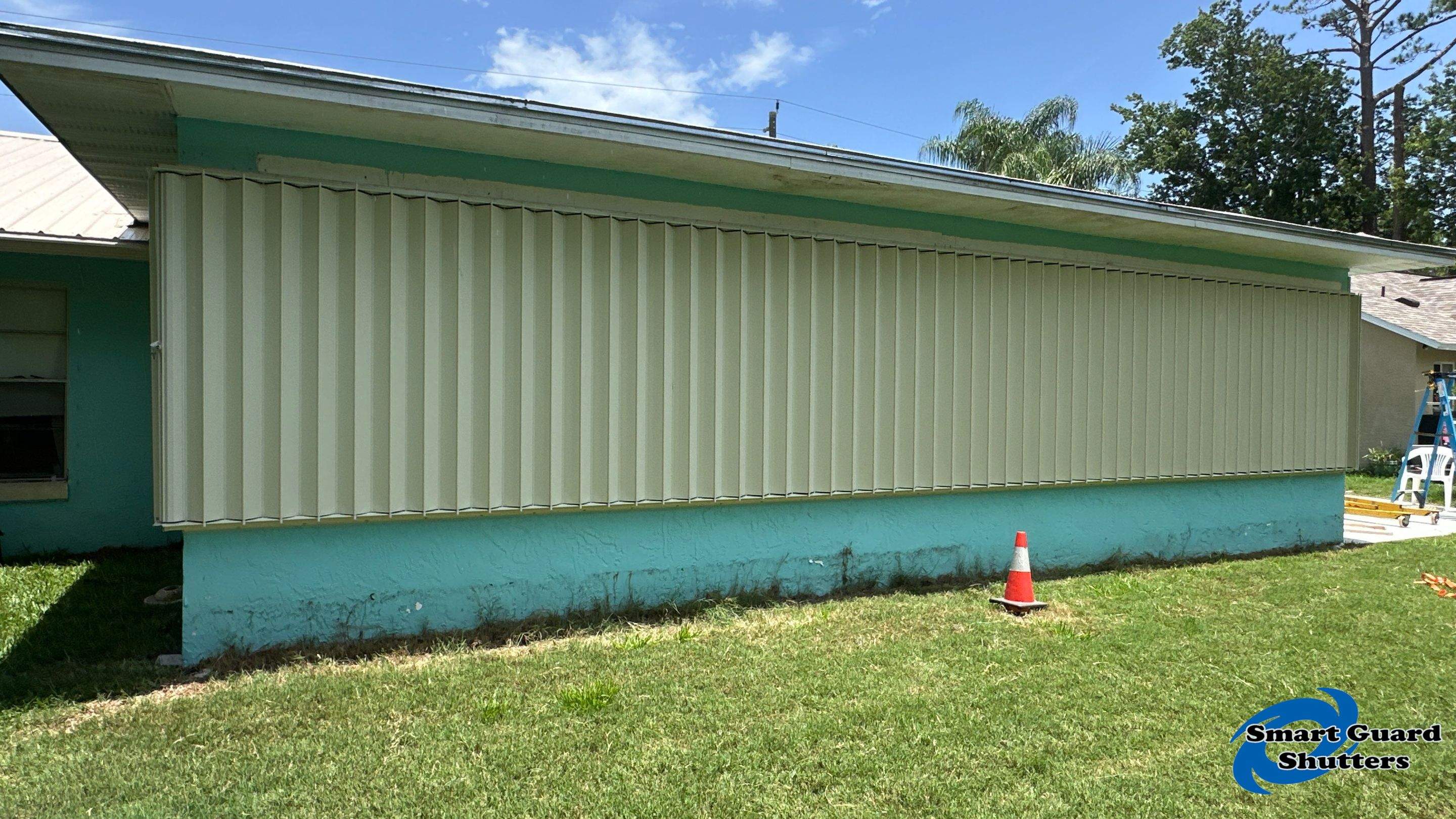 Accordion Shutter in Ivory by Smart Guard Shutters