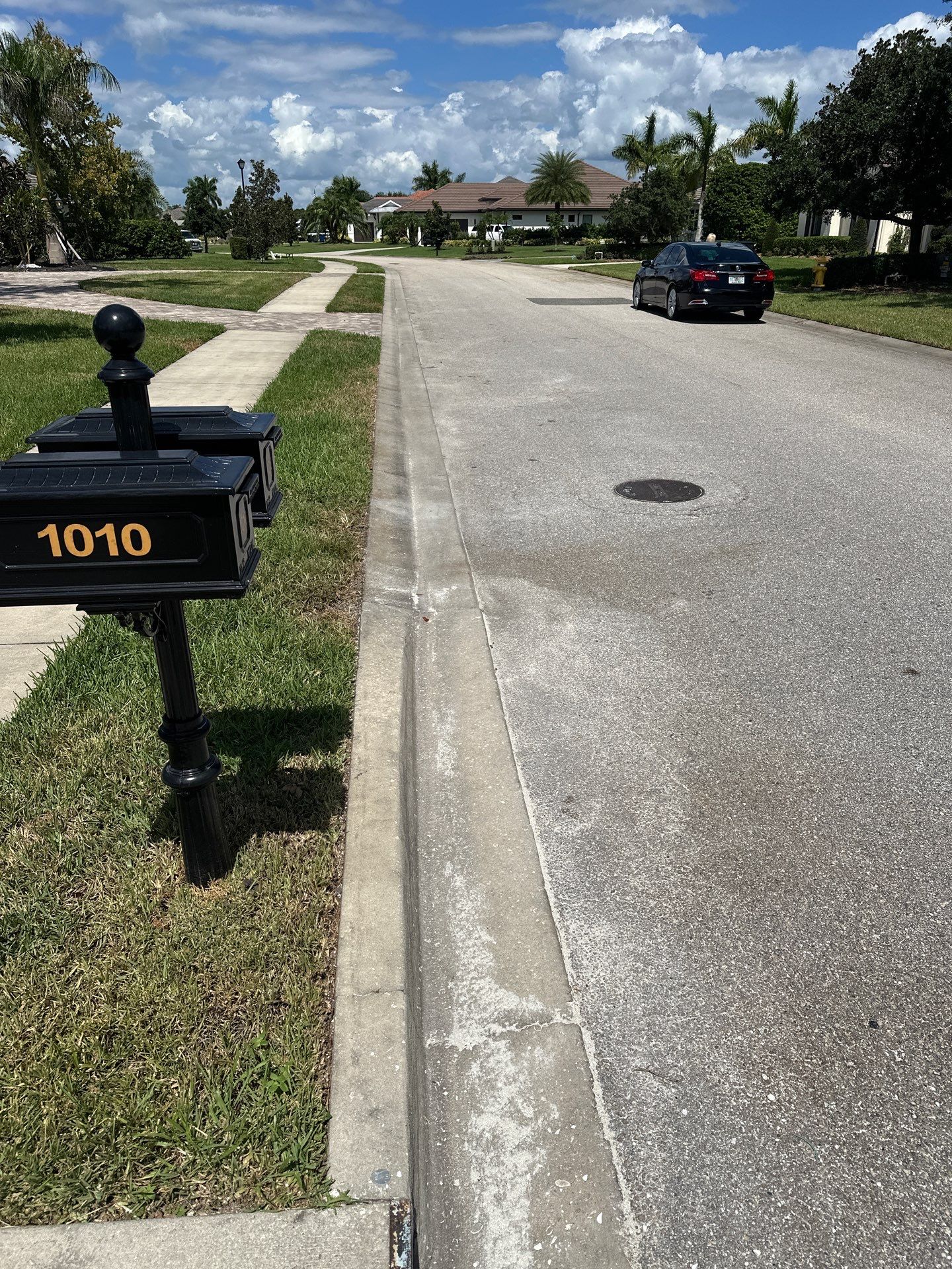 Paver Driveway, Entryway, Sidewalk, and Street Curbing Cleaning in Winding River Community, Bradenton, FL by Sunshine AquaWash