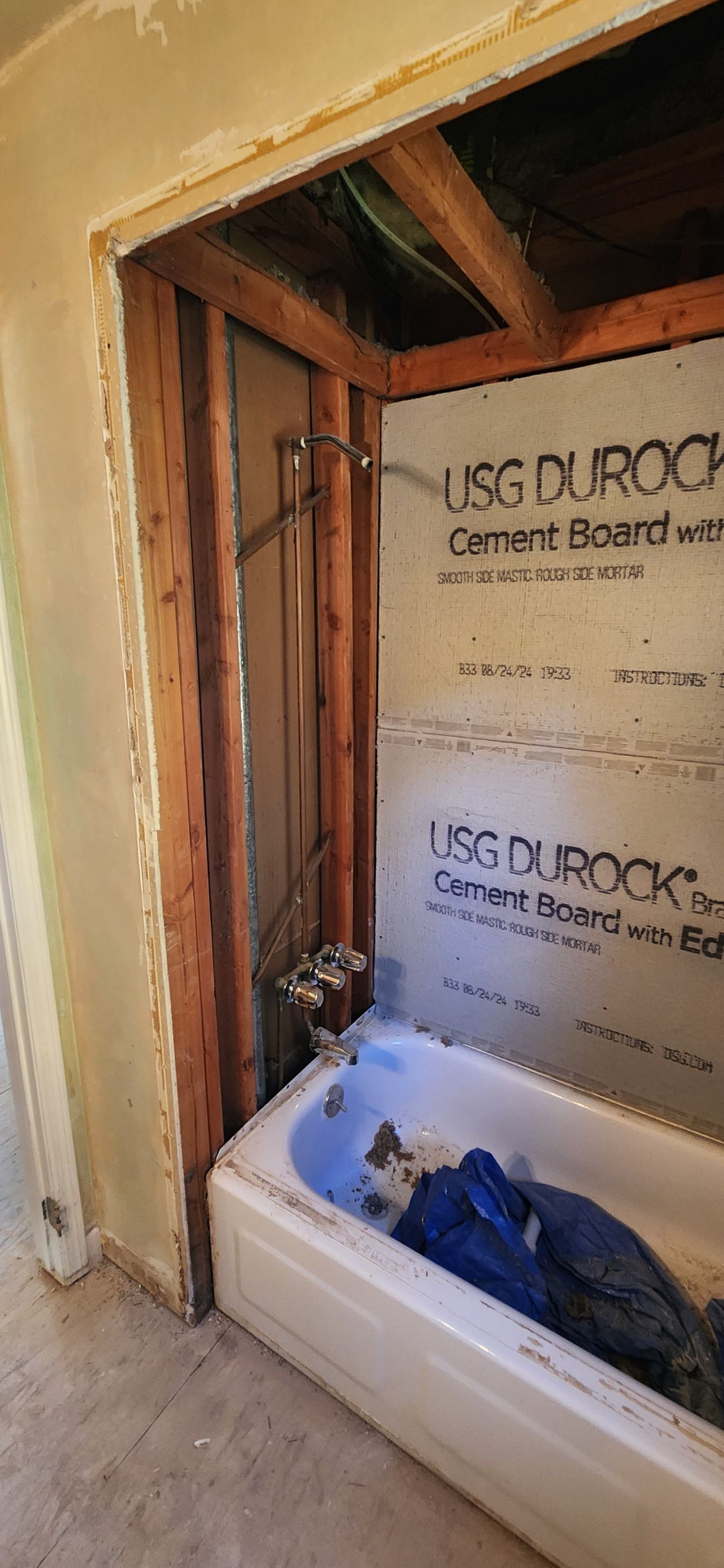 Bathroom Remodel using Porceline Tile from The Tile Shop by Footprints Floors Morristown