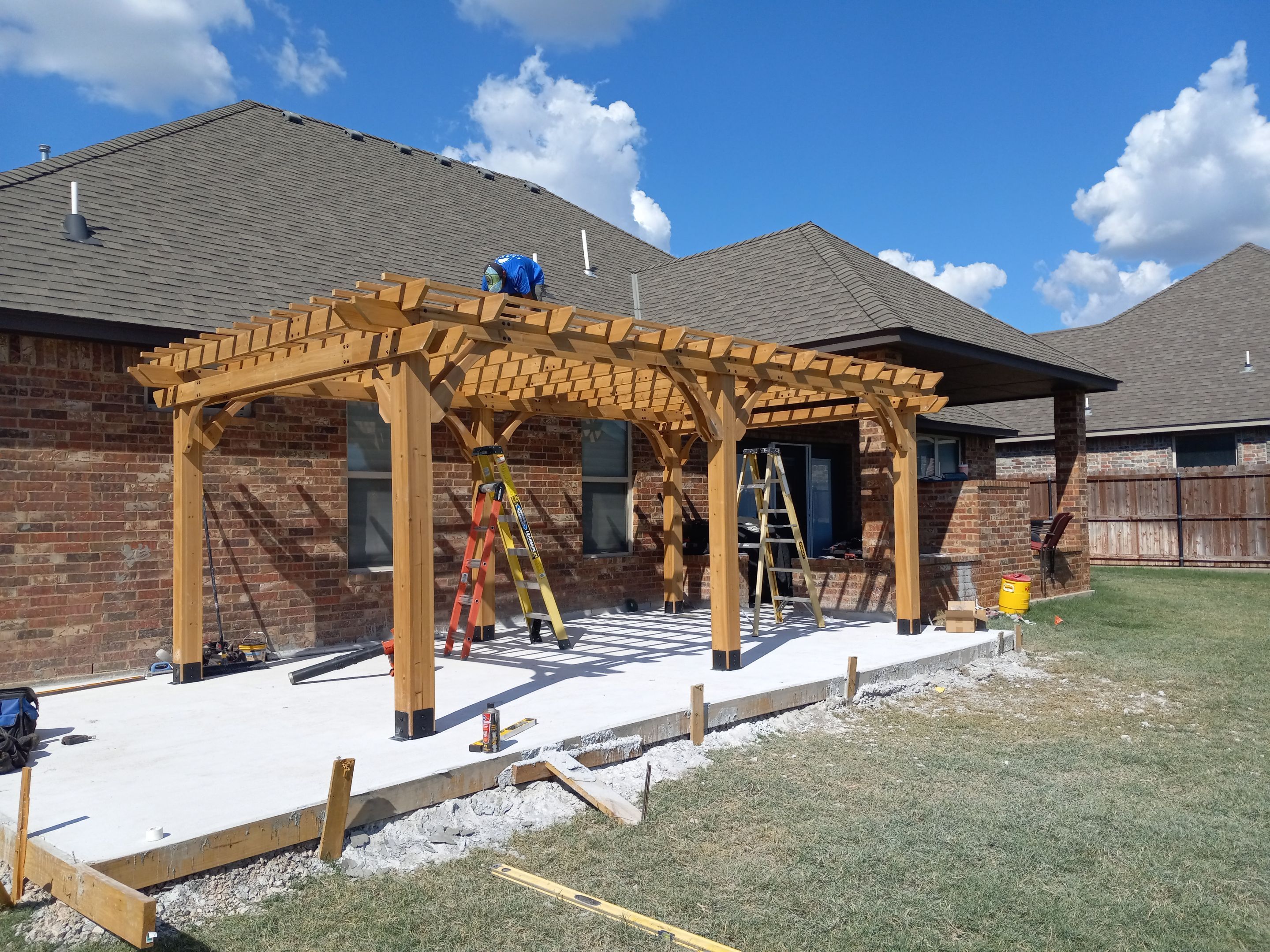 Concrete slab with Pergola by Clays Services Inc
