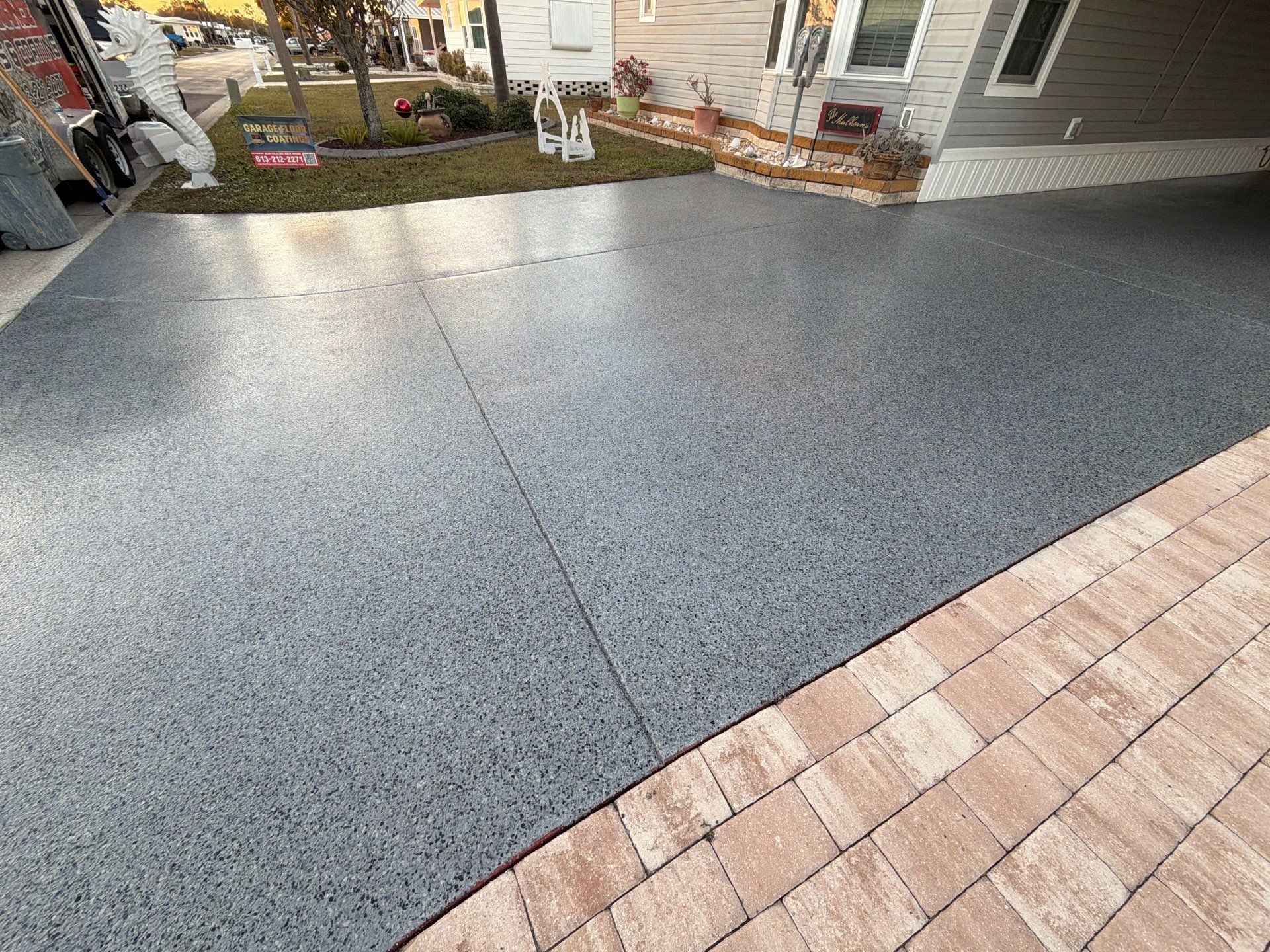 Driveway Transformation: Nightfall Flake System with Full UV & Moisture Protection by Performance Floors & Coating