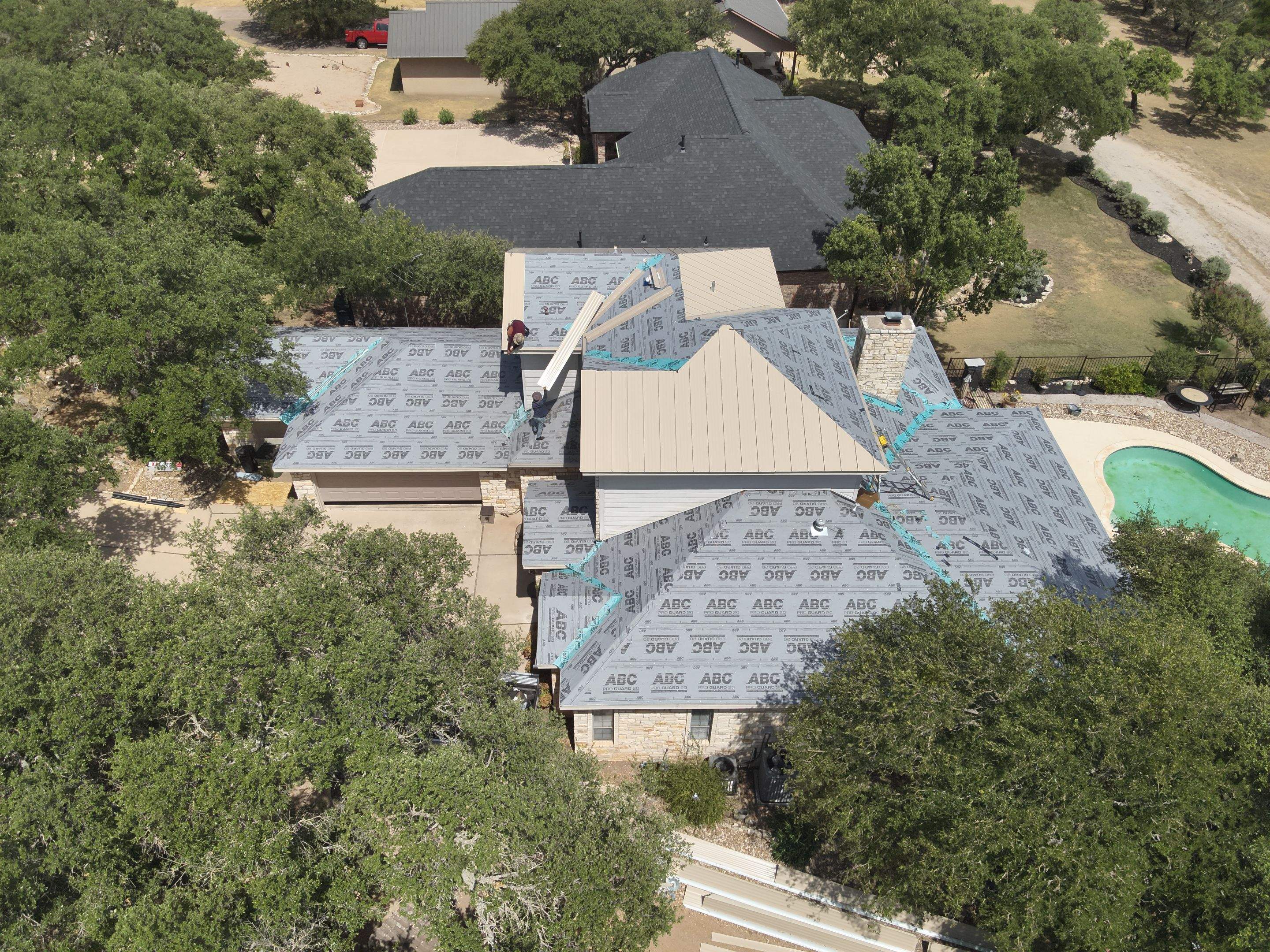 Residential Roof Replacement using 24 GA Double-Lock - Surrey Beige by Action Exteriors Austin