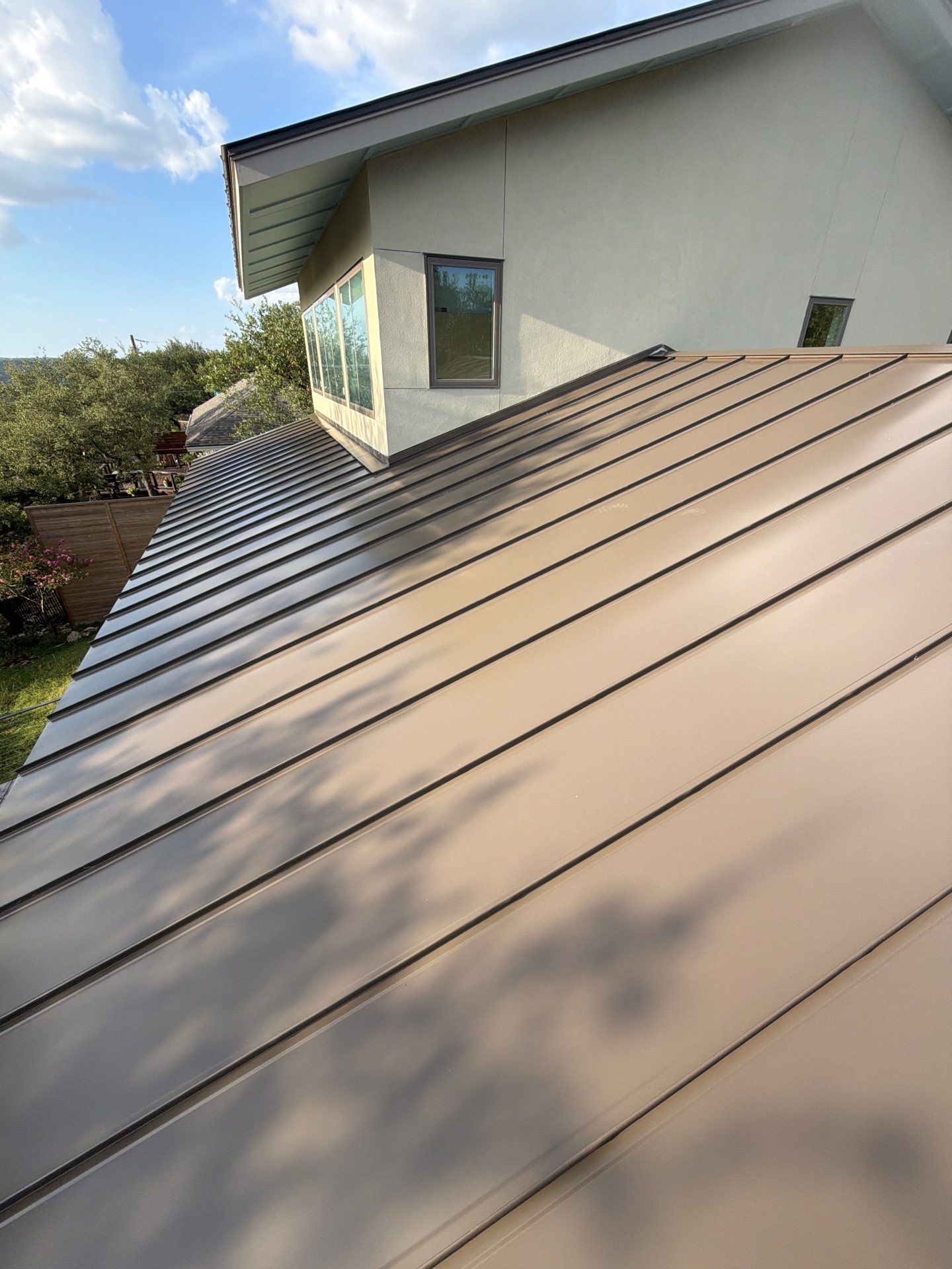 Residential Roof Replacement using 24 GA Double-Lock - Medium Bronze by Action Exteriors Austin