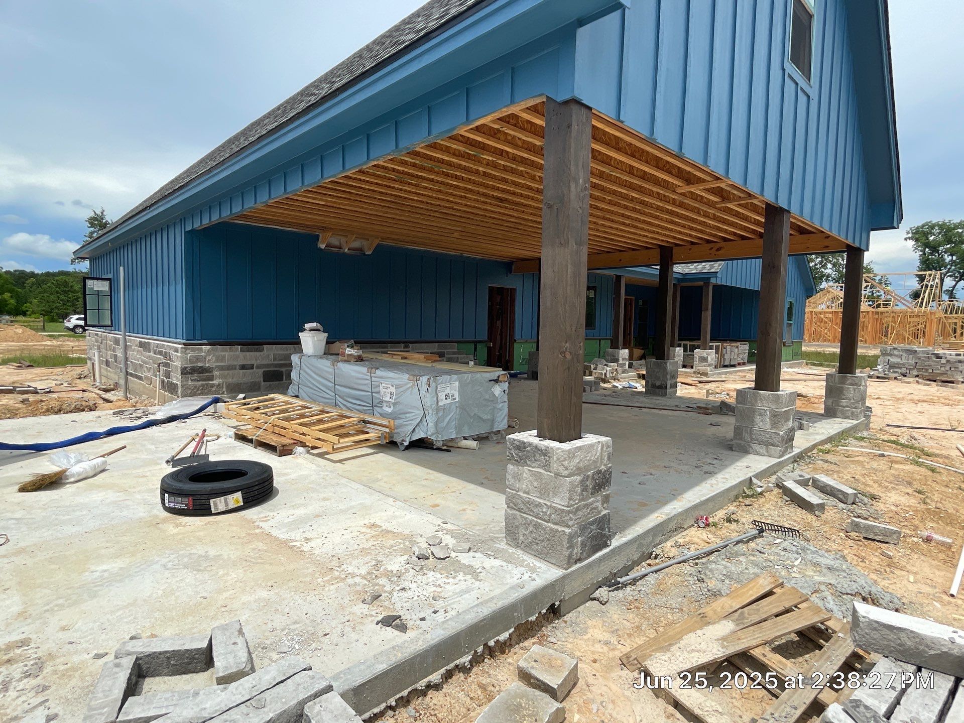 Natural Stone Elegance: Apex Installation Accented by Blue Siding by Apex Conventional Stucco Llc