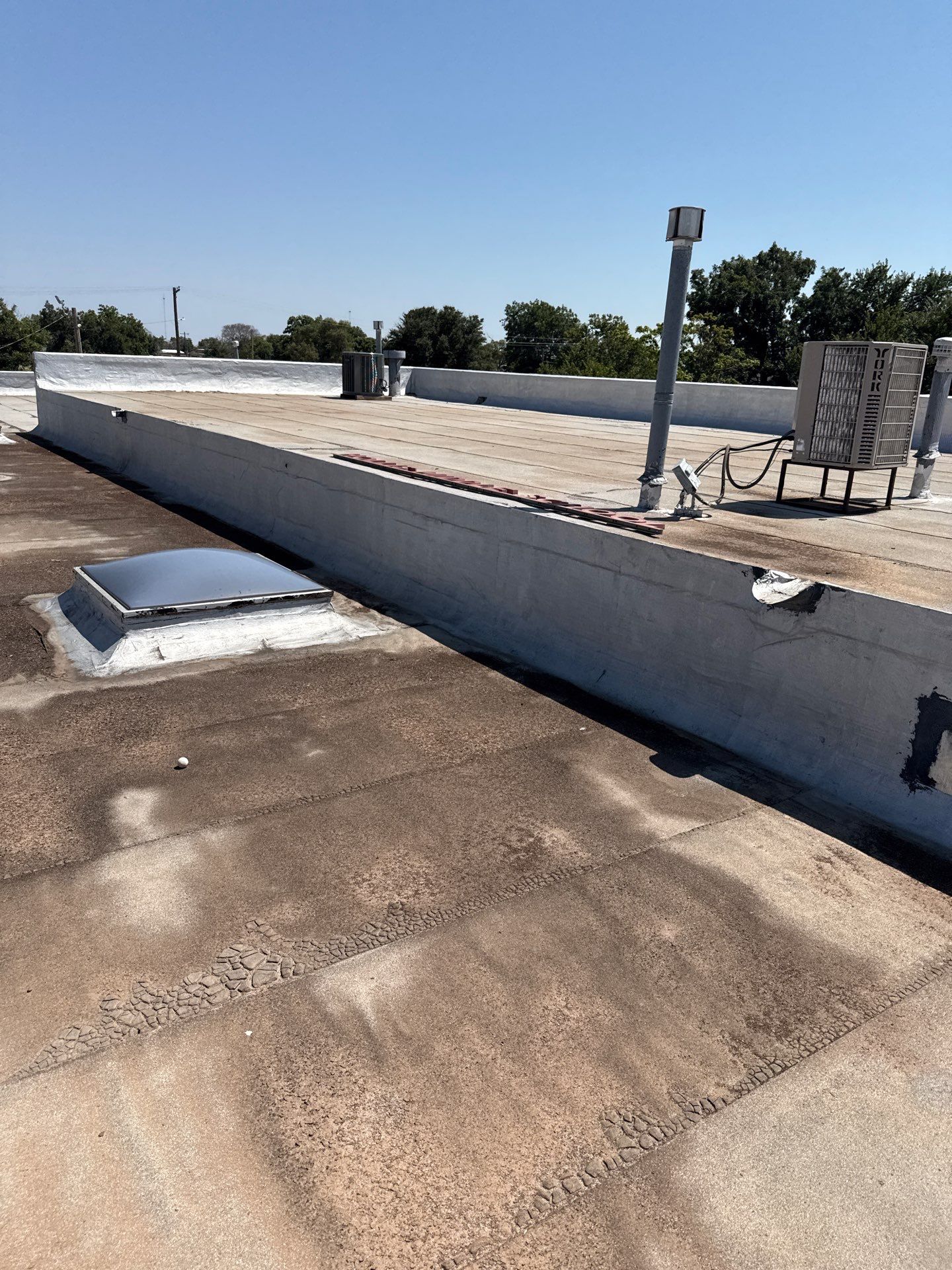 Hollis High School Comprehensive TPO Roof Replacement and Restoration by Secondary Rhodes