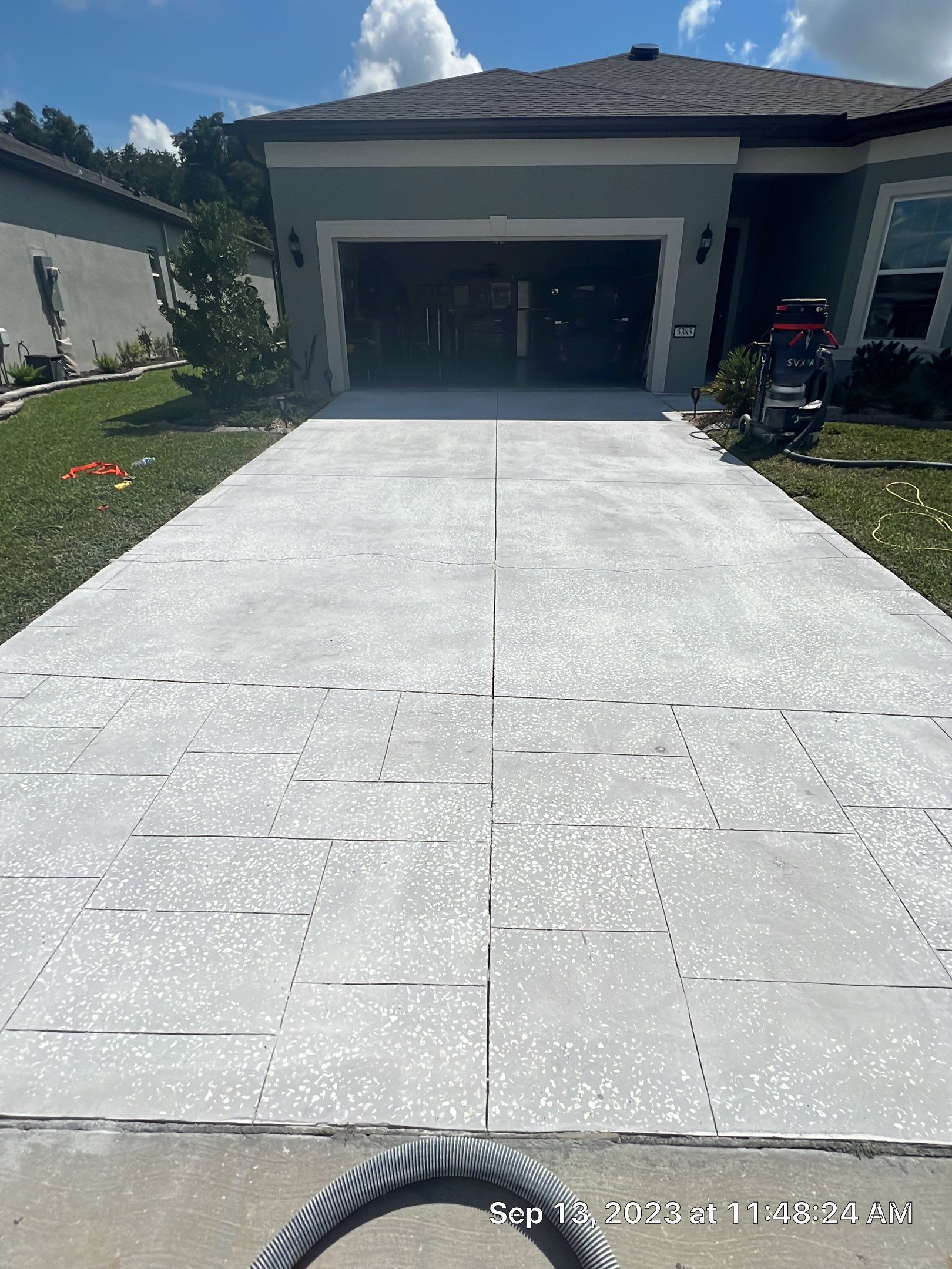 Driveway and Sidewalk in Slatestone with Silvercreek Border by Innovative Concrete Coatings 