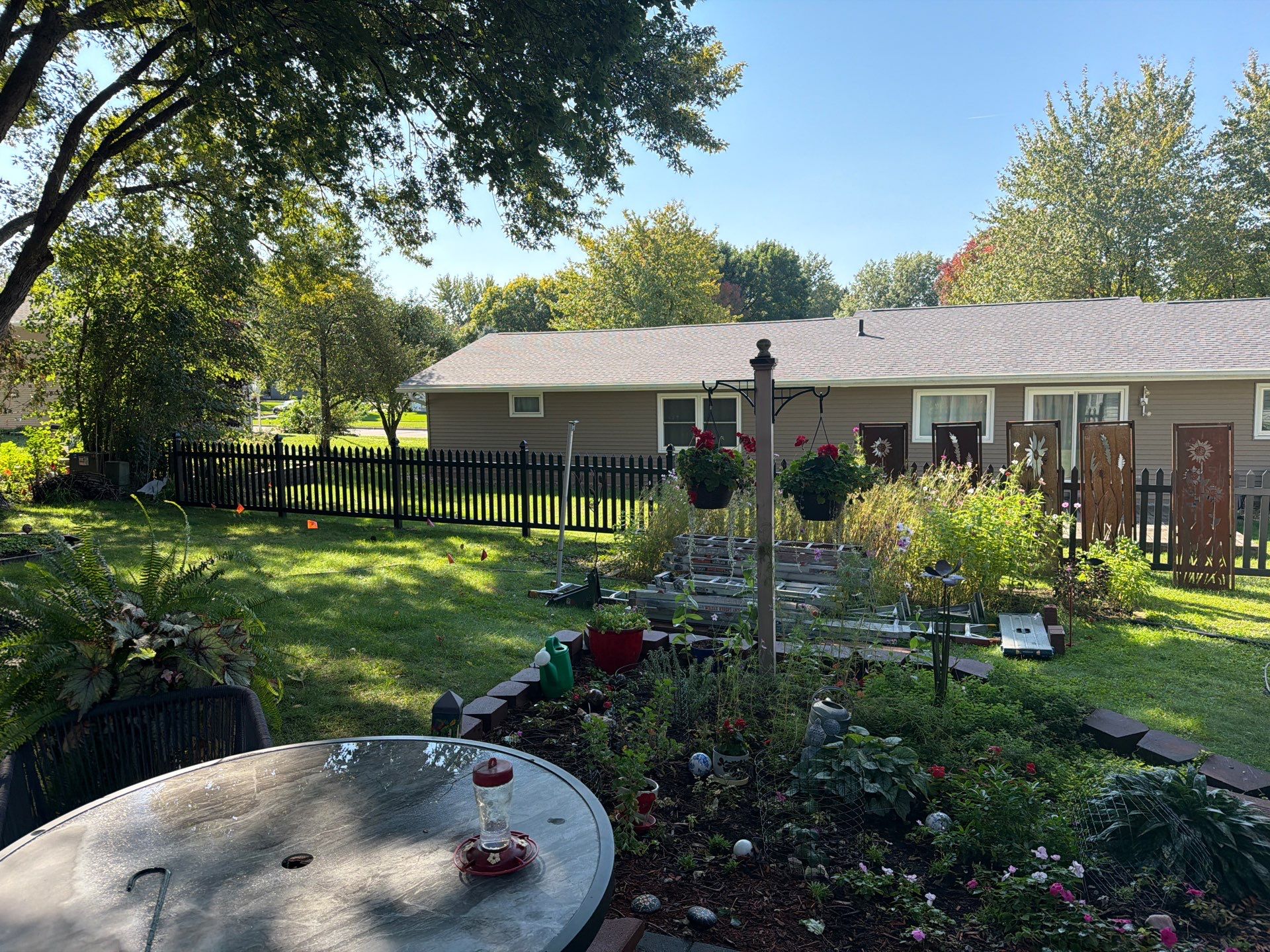 Black Vinyl Spaced Picket Fence Installation in Cedar Falls by Perfect Picket Fence and Stain