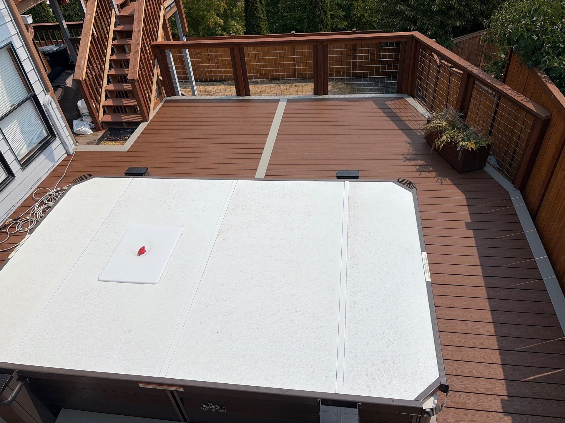 Tacoma Custom Composite Deck and Hot Tub Surround with Retaining Wall by Emerald City Energy 