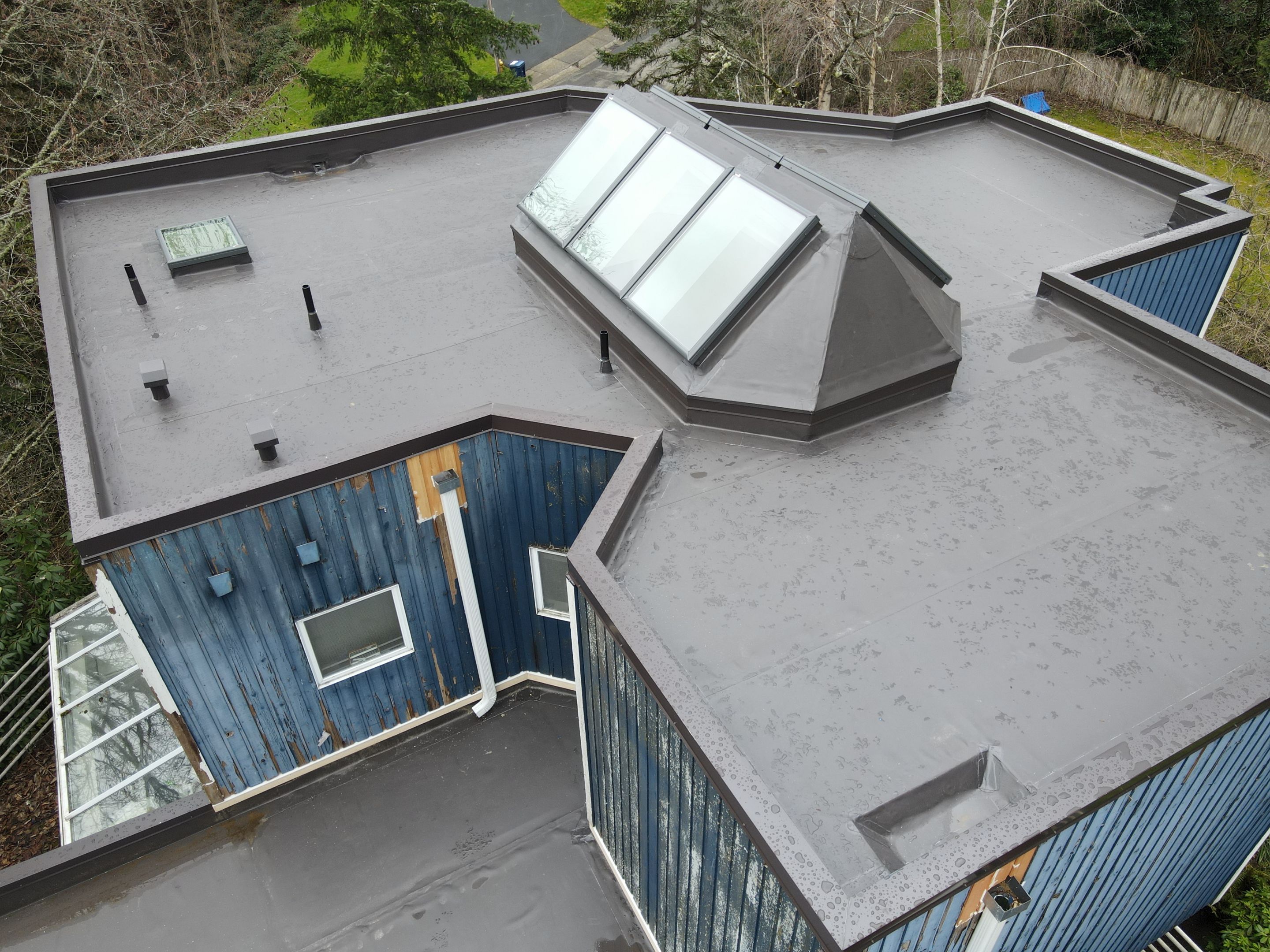 Flat Roof Replacement in Redmond with Custom Skylight using Duro-Last PVC by RoofSmart