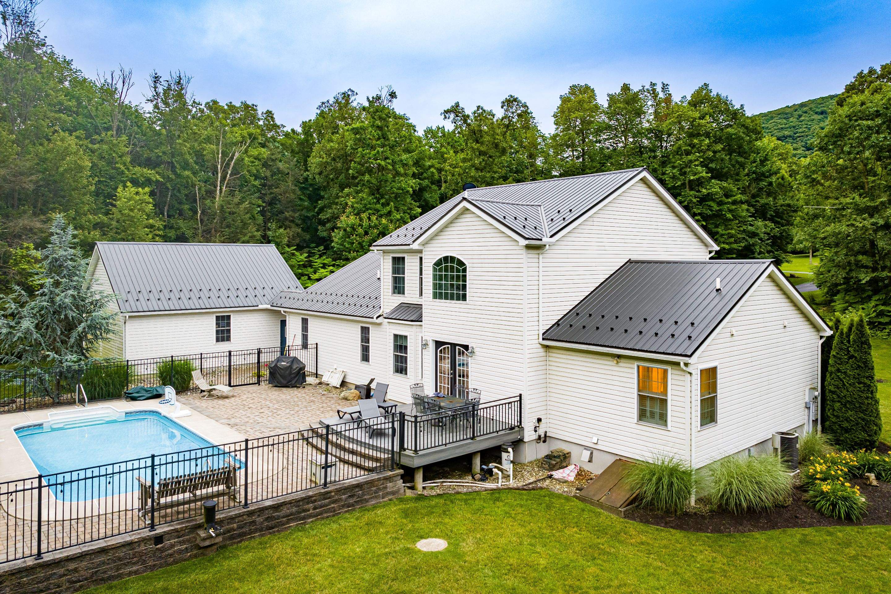 Metal roof install- shadow gray by Esh Builders