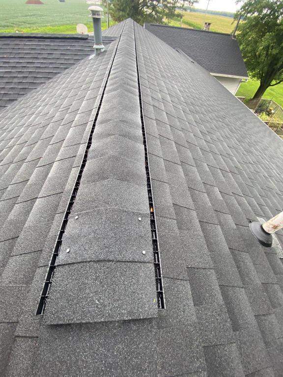 Storm damage roof replacement by Nitro Roofing and Construction