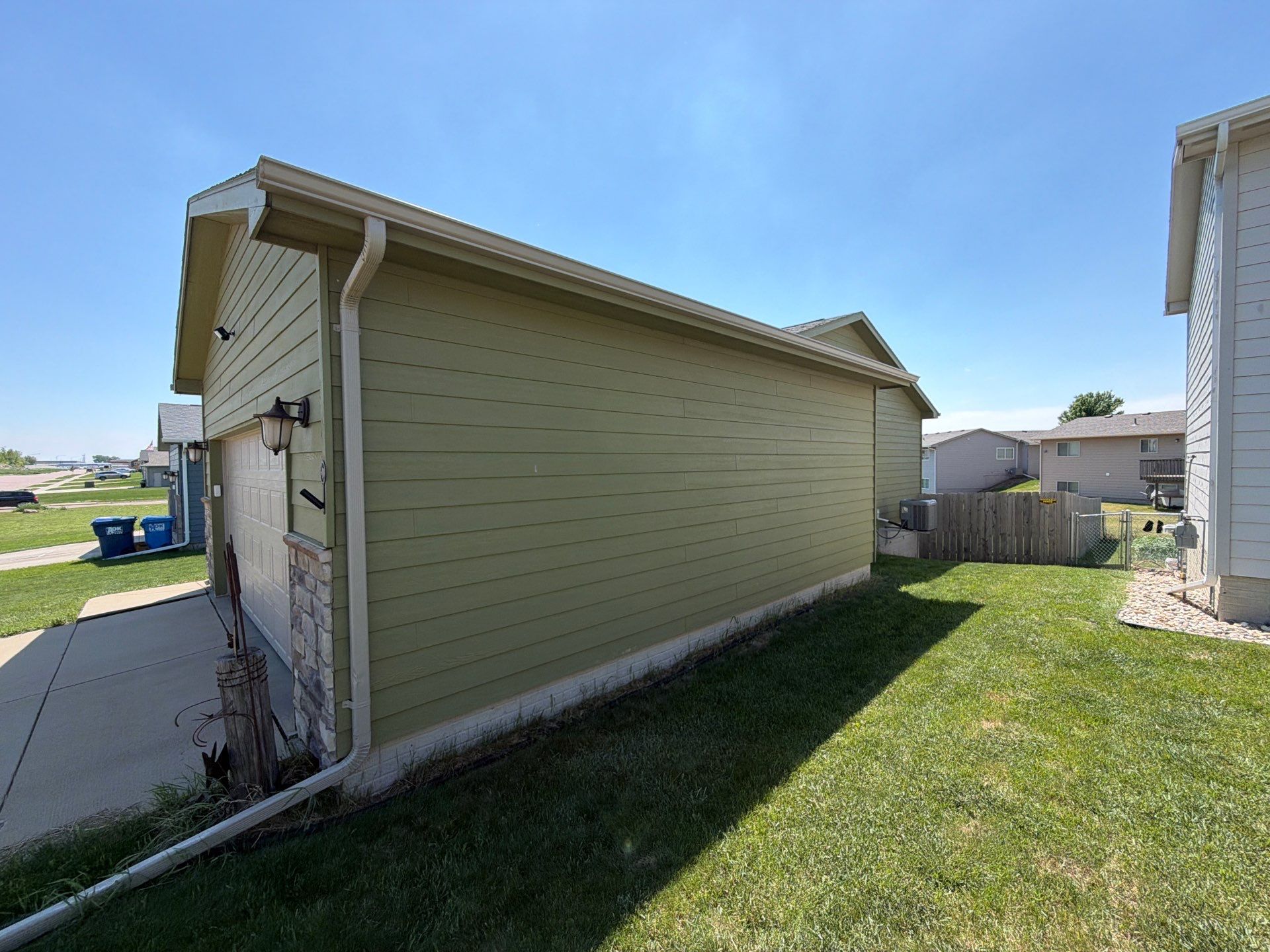 Exterior Painting and Custom Deck Construction in Sioux Falls by Select Painting, Coatings & Garage Cabinets