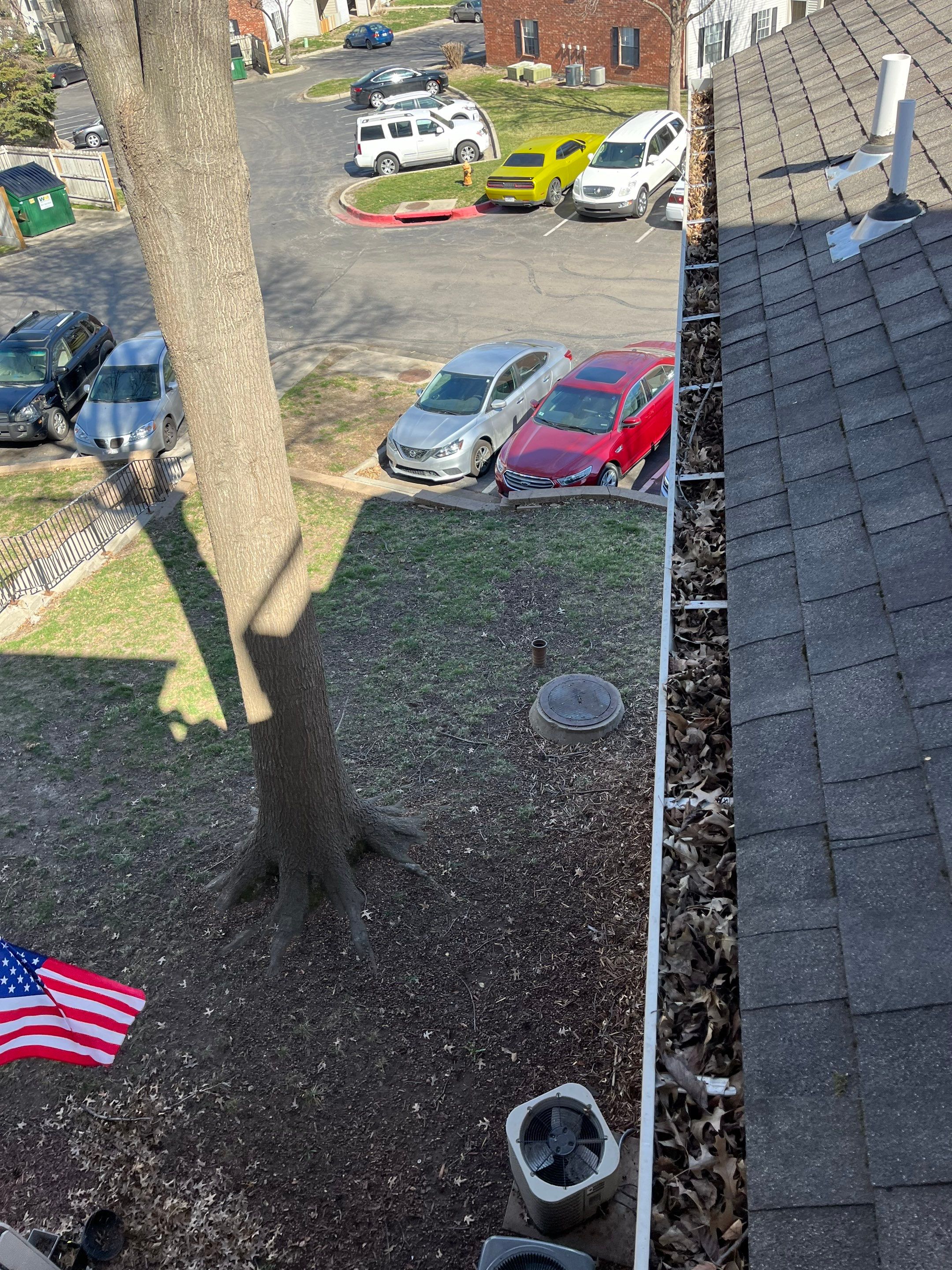 Commercial gutter cleaning Kansas City before photo with filled gutters