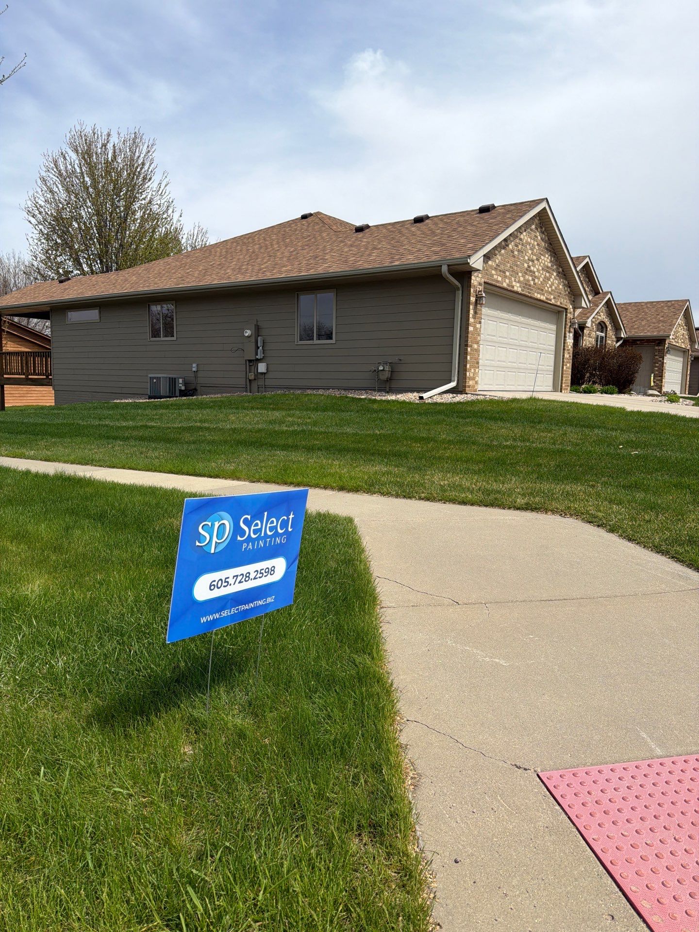 Residential Exterior Siding and Trim Painting in Sioux Falls by Select Painting, Coatings & Garage Cabinets