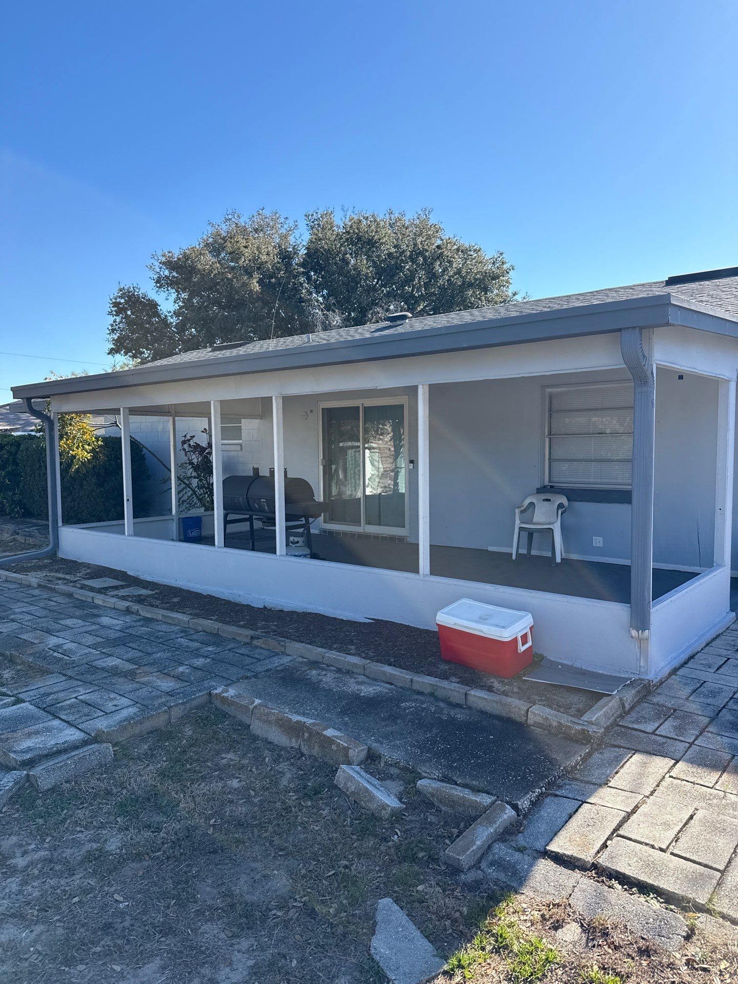 Downspout Installation using Downspout Extension and new Gutters in Winter Haven FL by Gutter Professors