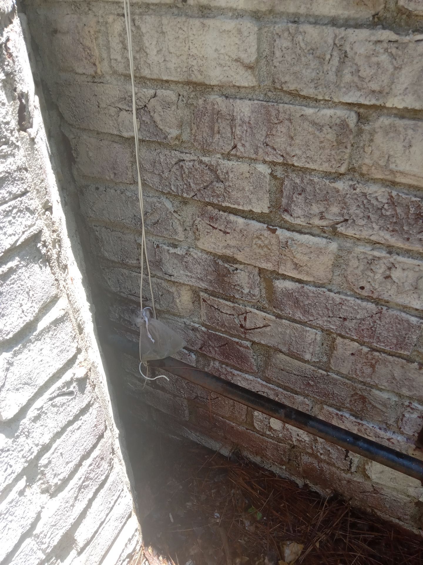 pressure washing company cleaning exterior brick wall removing dirt buildup and stains from the surface