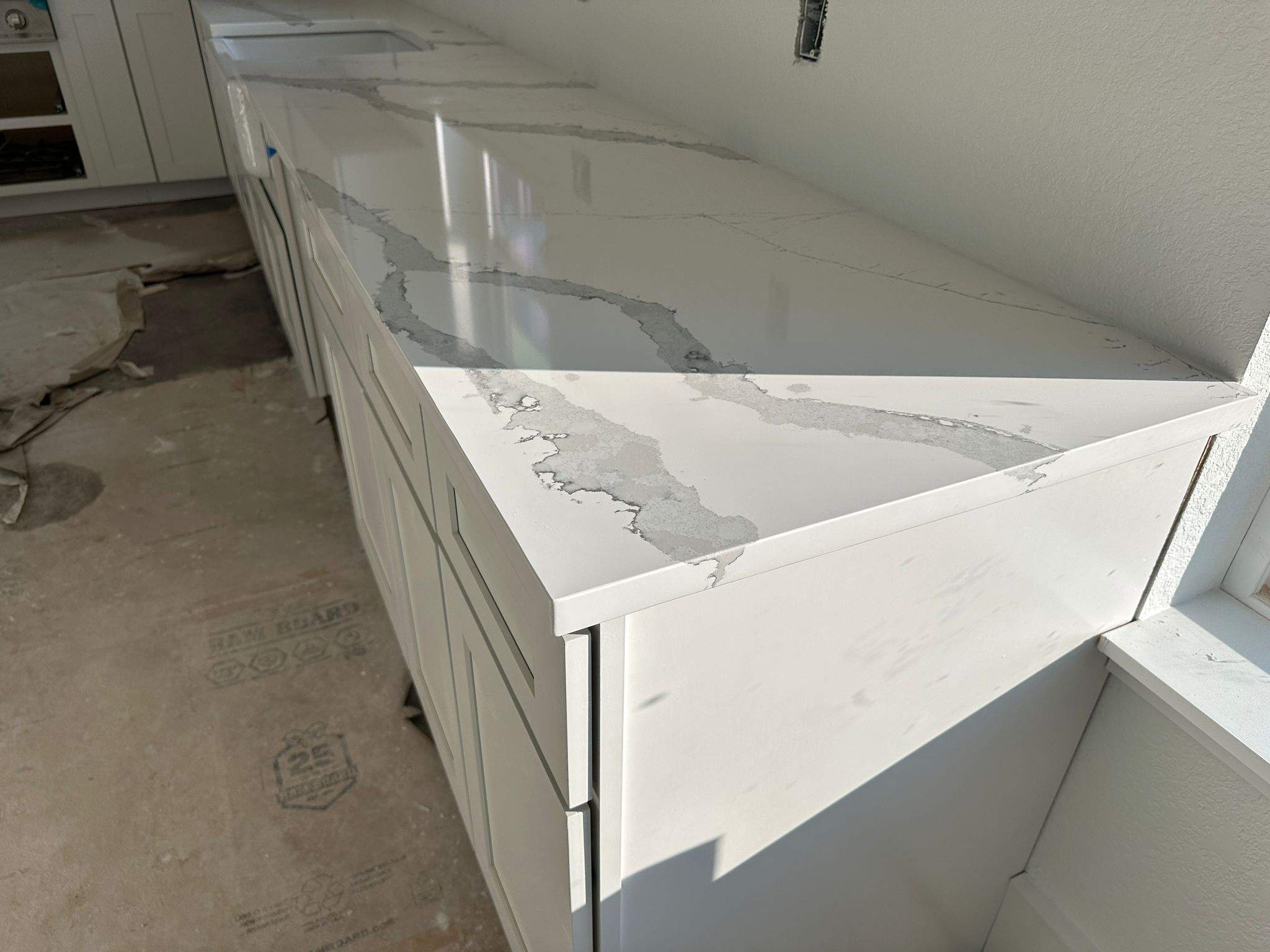 Kitchen and Bathroom Countertop Upgrades Featuring Gray Veined Quartz by Mena stone surfaces
