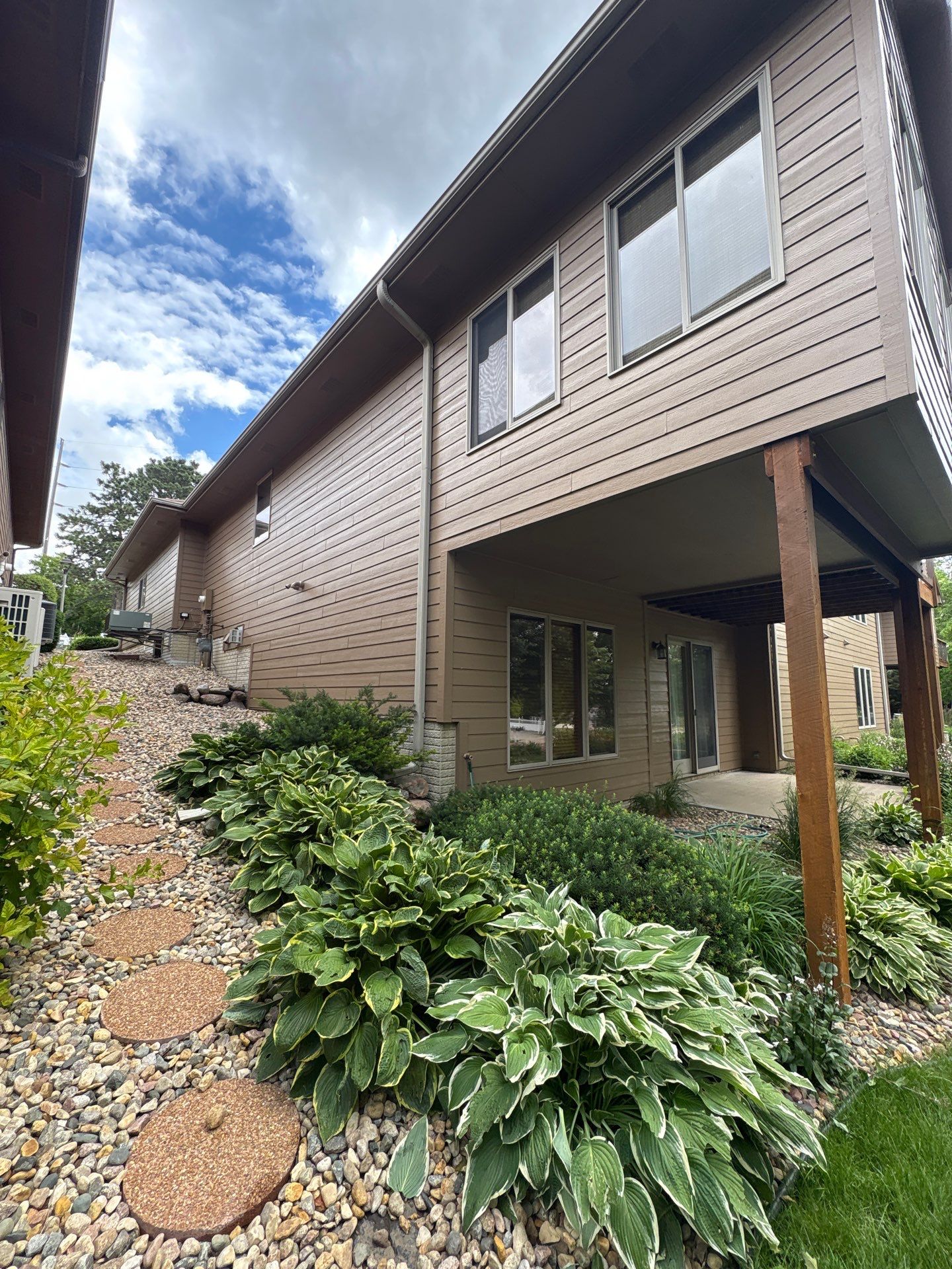 Multi-Story Residential Exterior Painting and Siding Refresh in Sioux Falls by Select Painting, Coatings & Garage Cabinets
