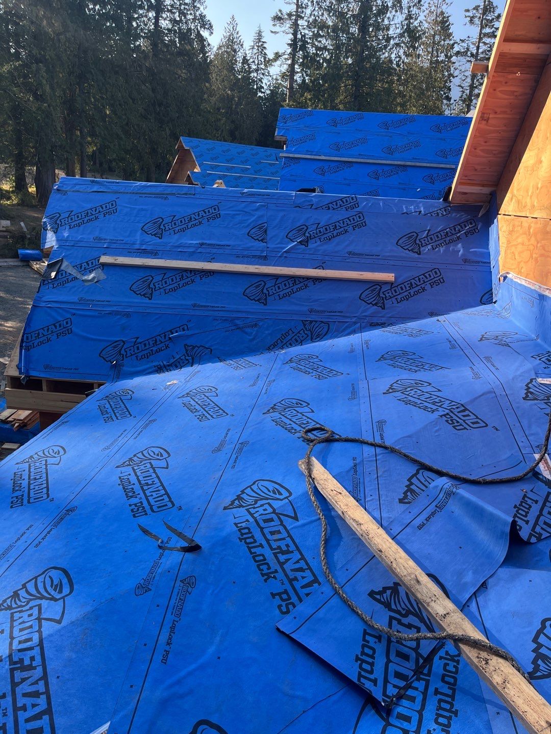 Residential Roofing Installation using 12" Prolok metal by Top Notch Roofing Inc