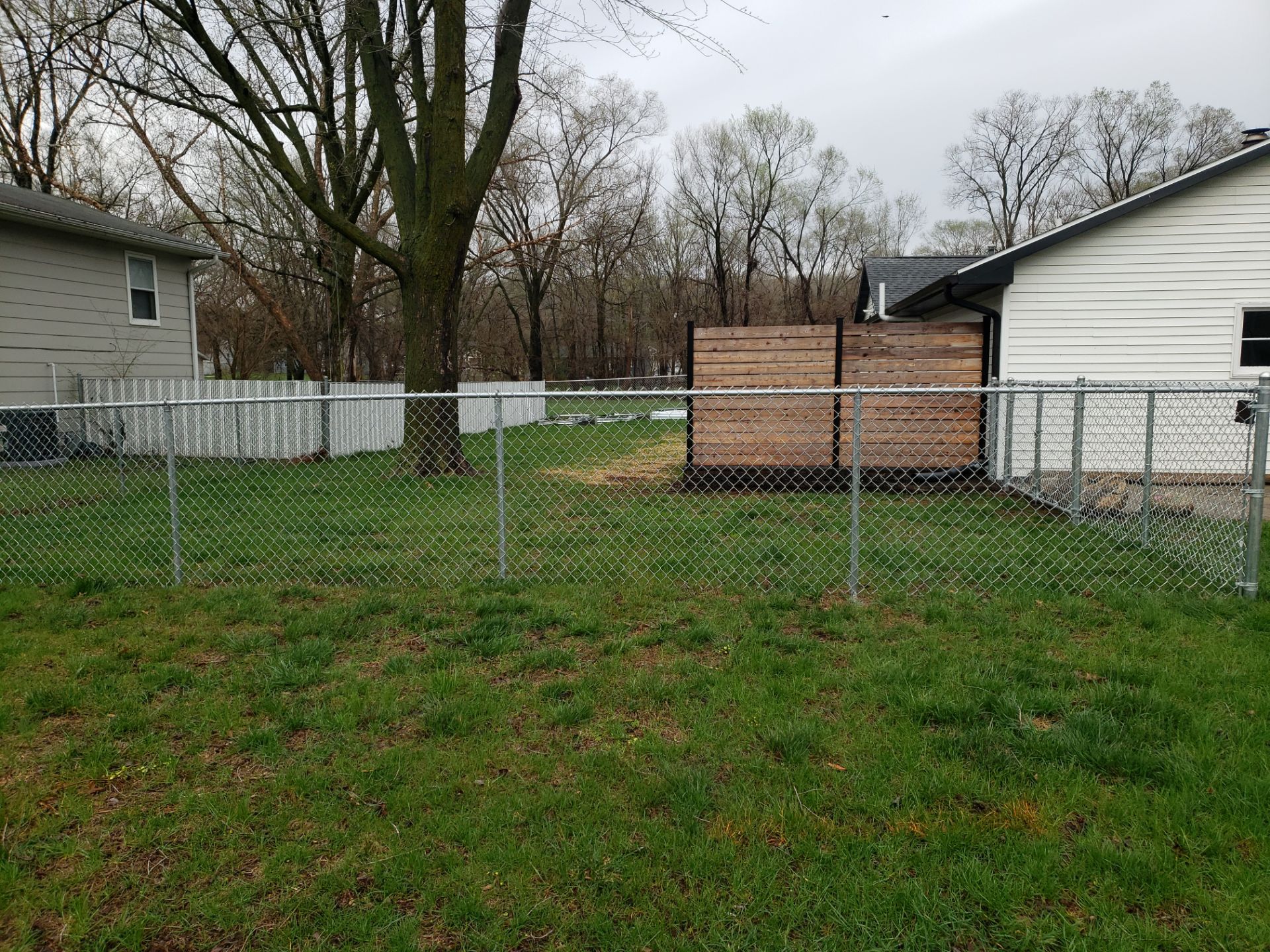 Galvanized Chain Link and Horizontal Wood Privacy Fencing in Waterloo by Perfect Picket Fence and Stain
