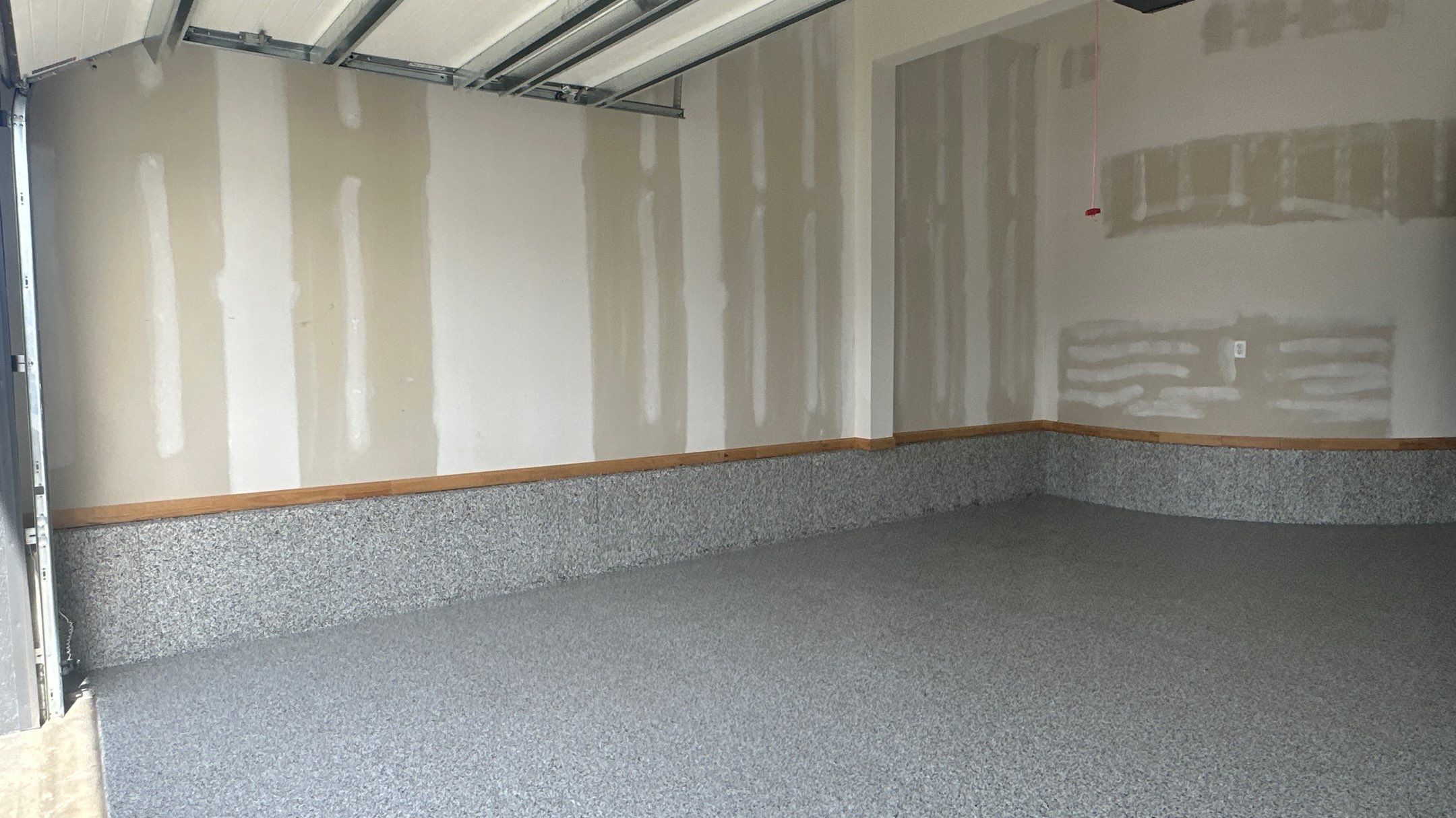 Megan J. added cabinets and slotwall to her garage. Plus a New Floor by Banner Garage