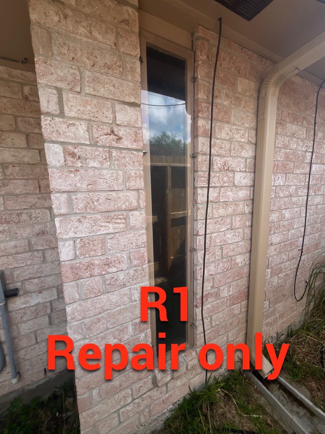 Colored Vinyl Windows to blend into brick by Bayfront Roofing and Construction