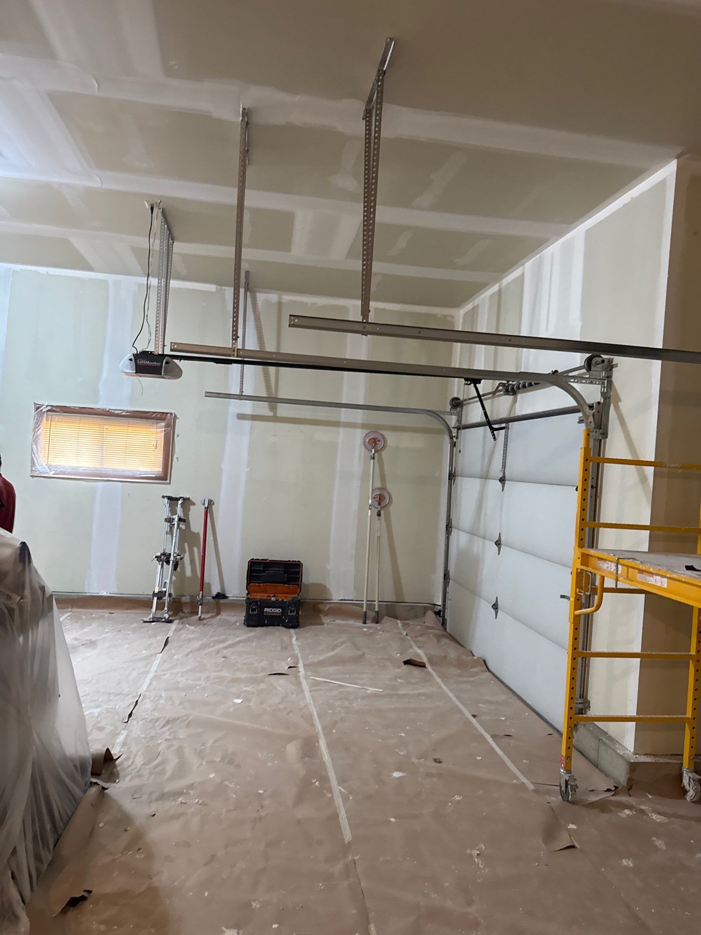 Residential Garage Interior Painting and Drywall Repair in Tea by Select Painting, Coatings & Garage Cabinets