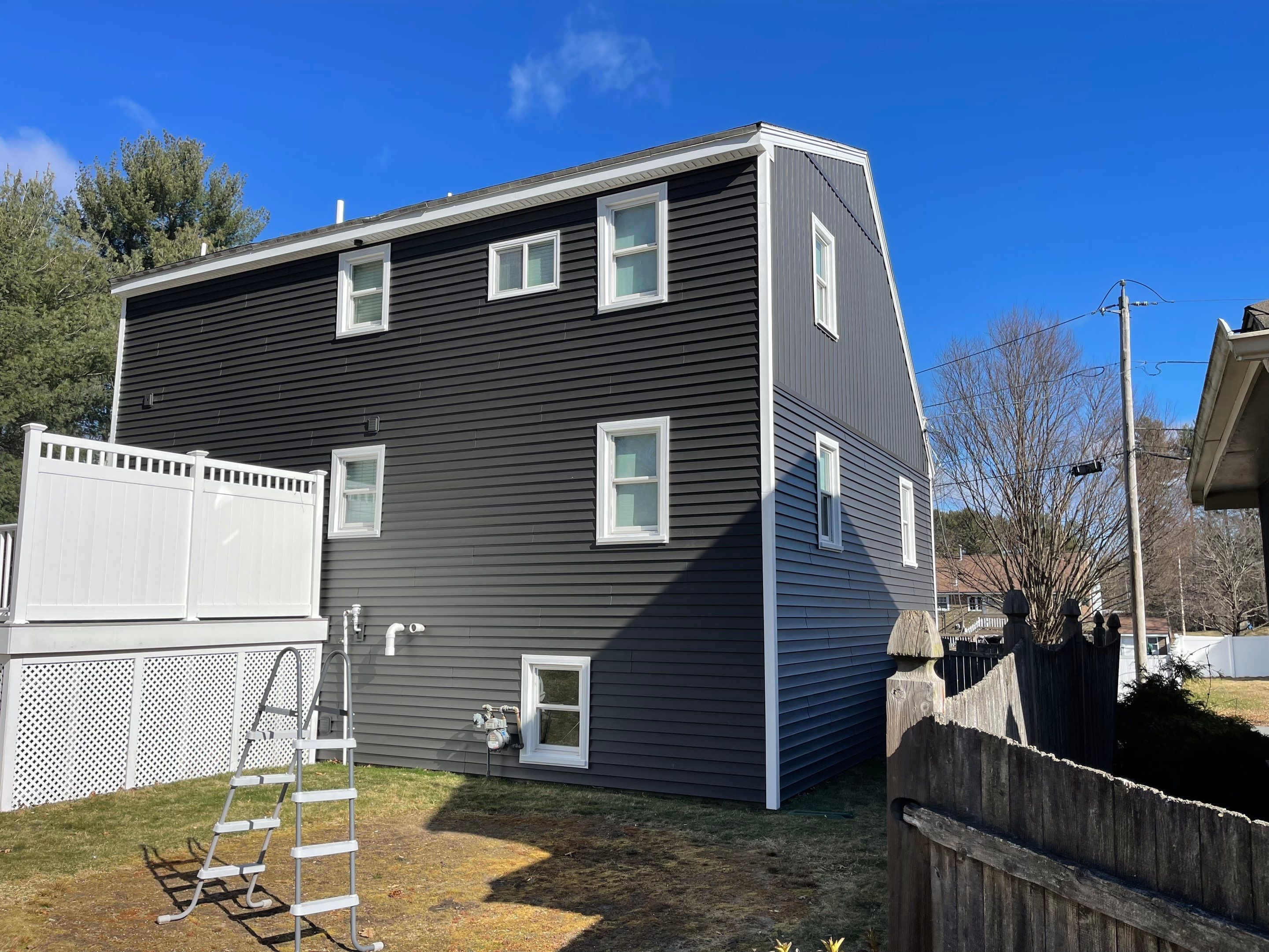 Complete Exterior Renovation with New Siding & Gutters   by Sensible Home Solutions