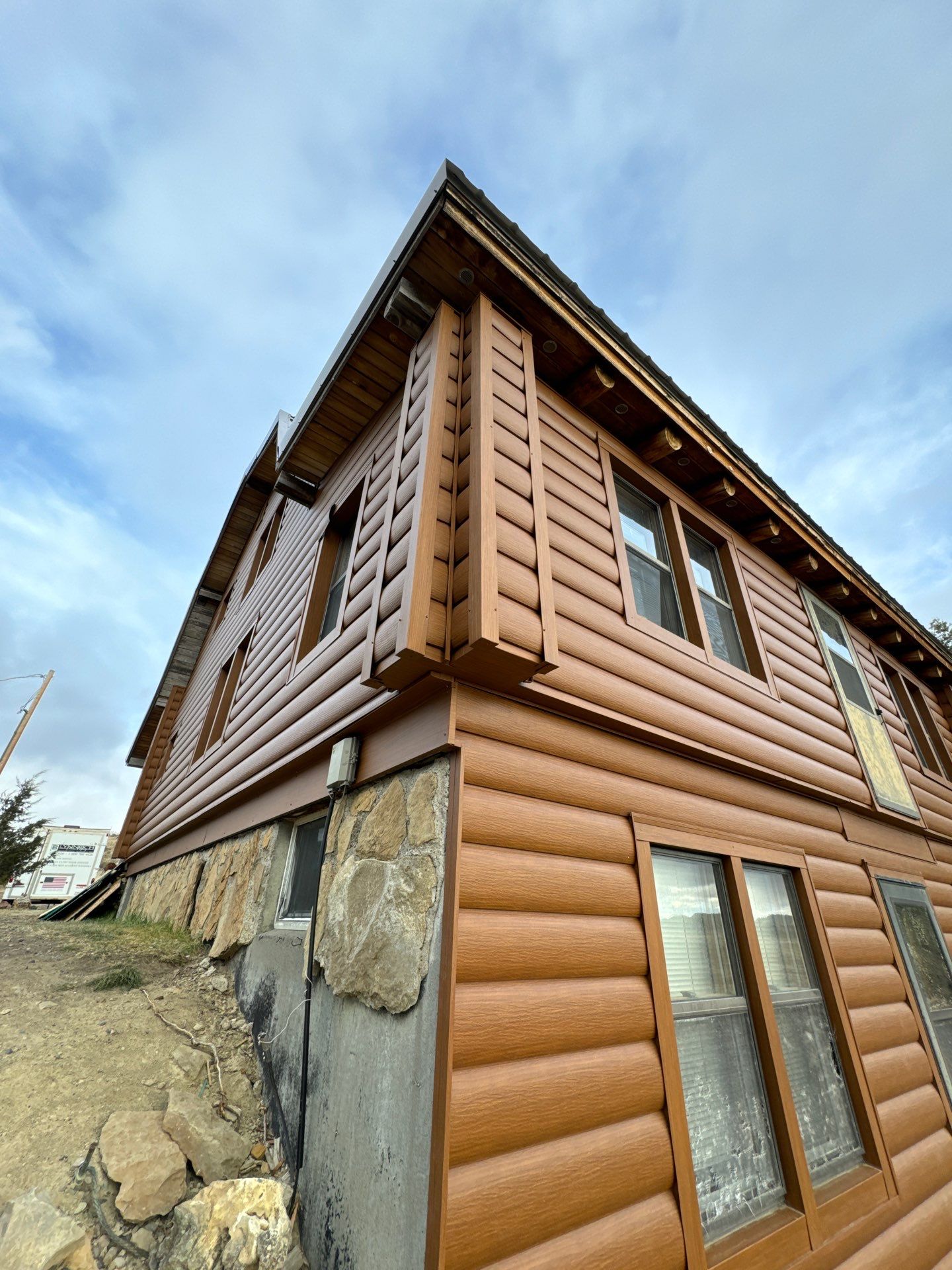 Siding Installation using Log Siding by Lynnrich Seamless Siding, Windows & Doors