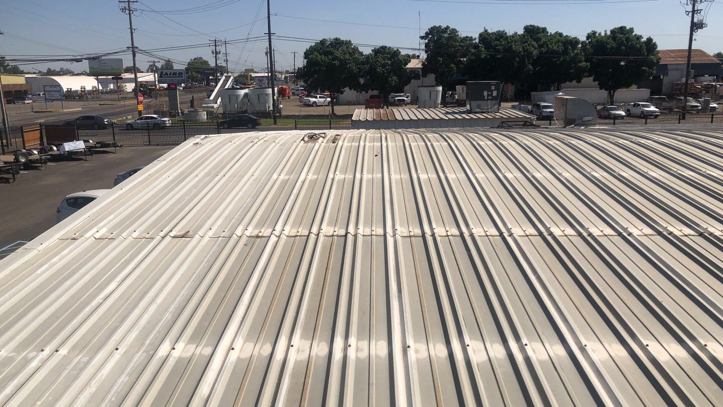 Metal Restoration Roofing system with Benchmark/PUMA XL 20 yr warranty by Straight Edge Roofing Inc