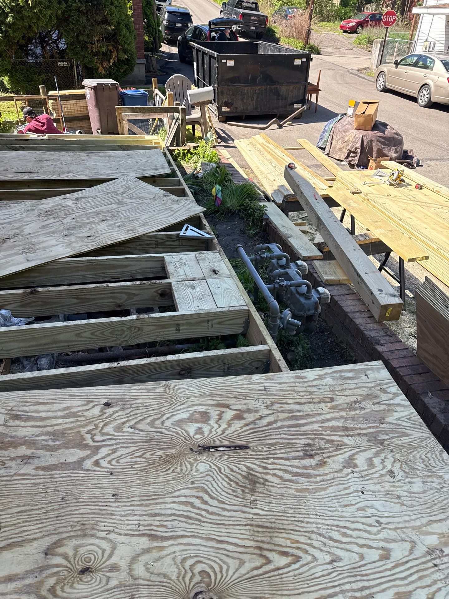 Roof sunspace deck  by Cousins Roofing Siding & Decks