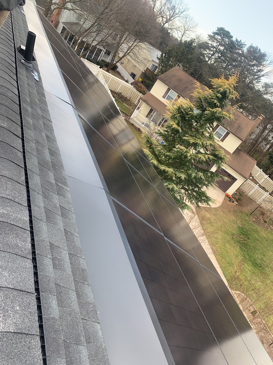 Roof Replacement with GAF Decotech integrated solar panels by American Home Contractors