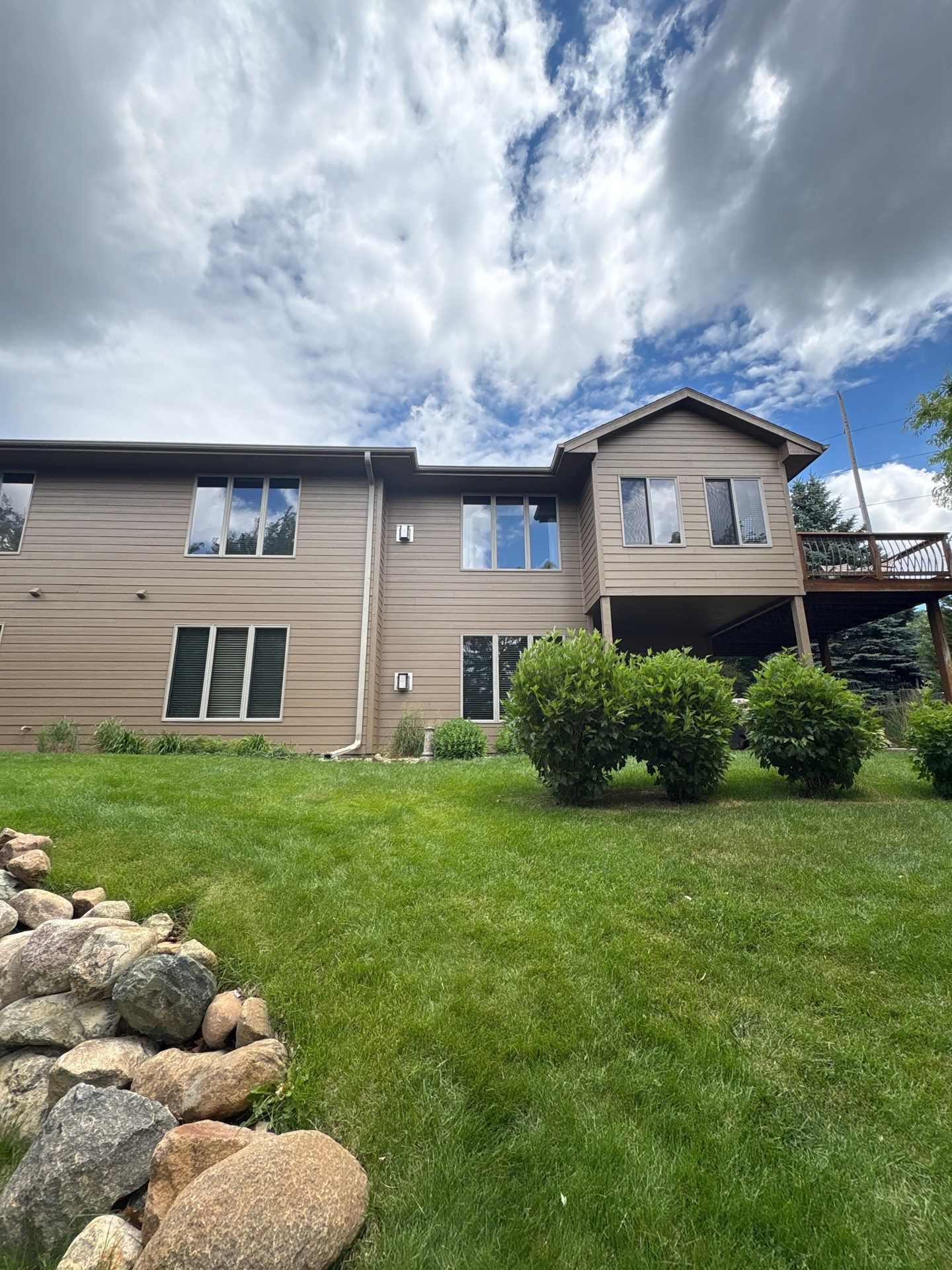 Multi-Story Residential Exterior Painting and Siding Refresh in Sioux Falls by Select Painting, Coatings & Garage Cabinets
