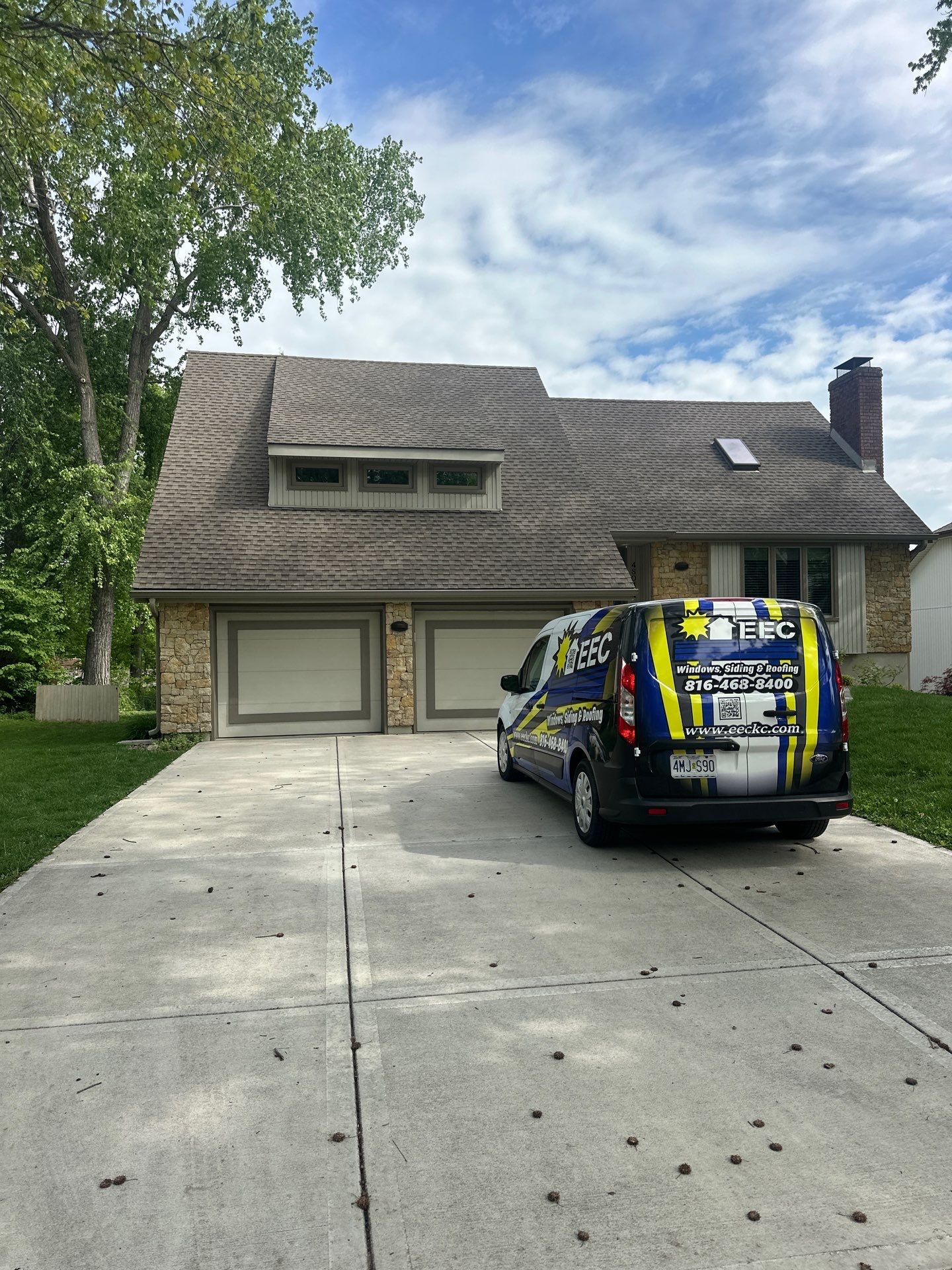 Comprehensive Kansas City Exterior Remodel Featuring Board And Batten Siding by EEC Windows, Siding & Roofing