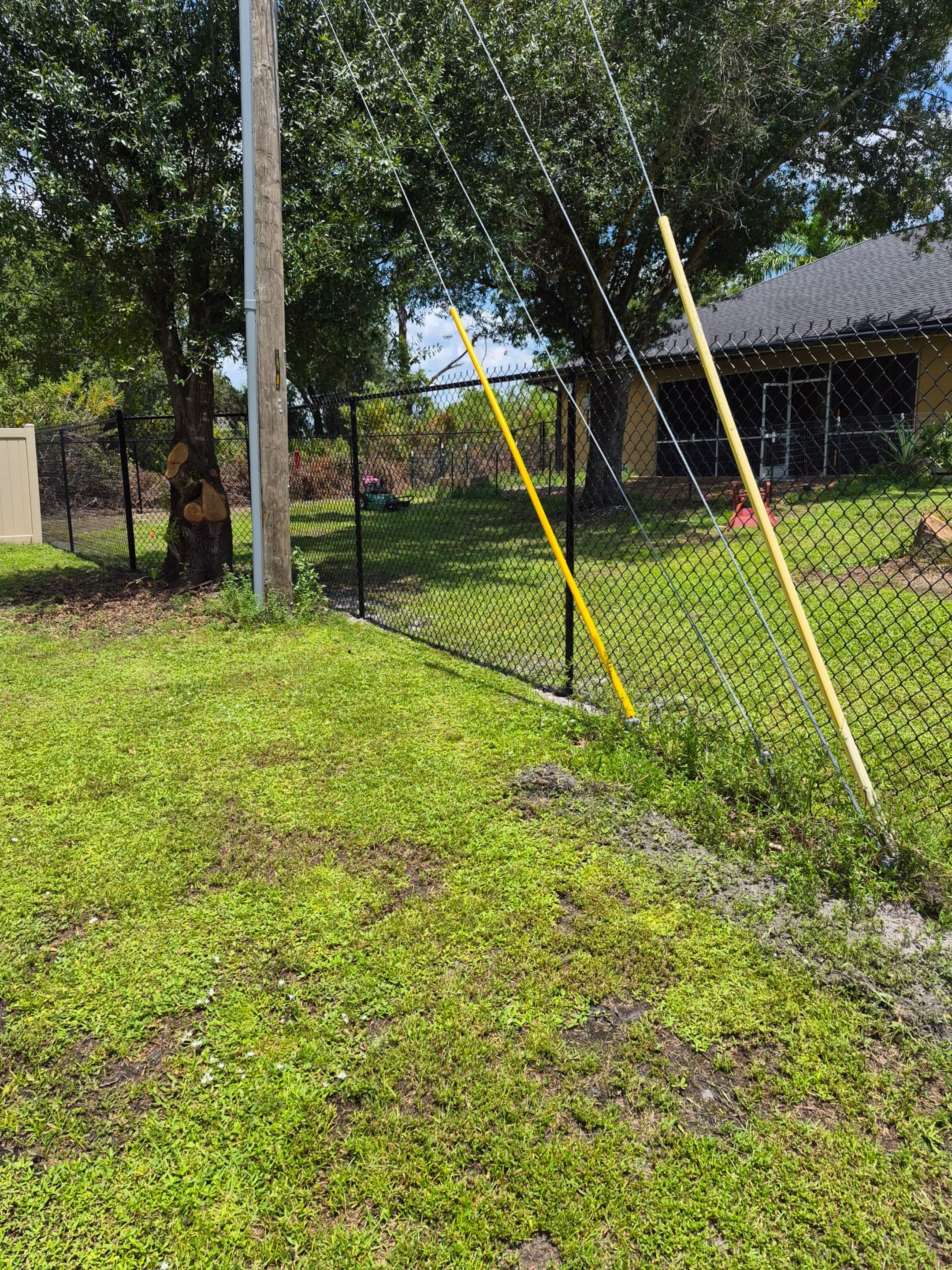 Black Chain Link Perimeter Fencing with Double Gates in Port Charlotte by True Fence LLC