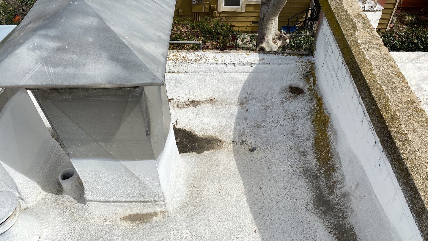 Polyurethane foam roof refurbish and recoating by Straight Edge Roofing Inc