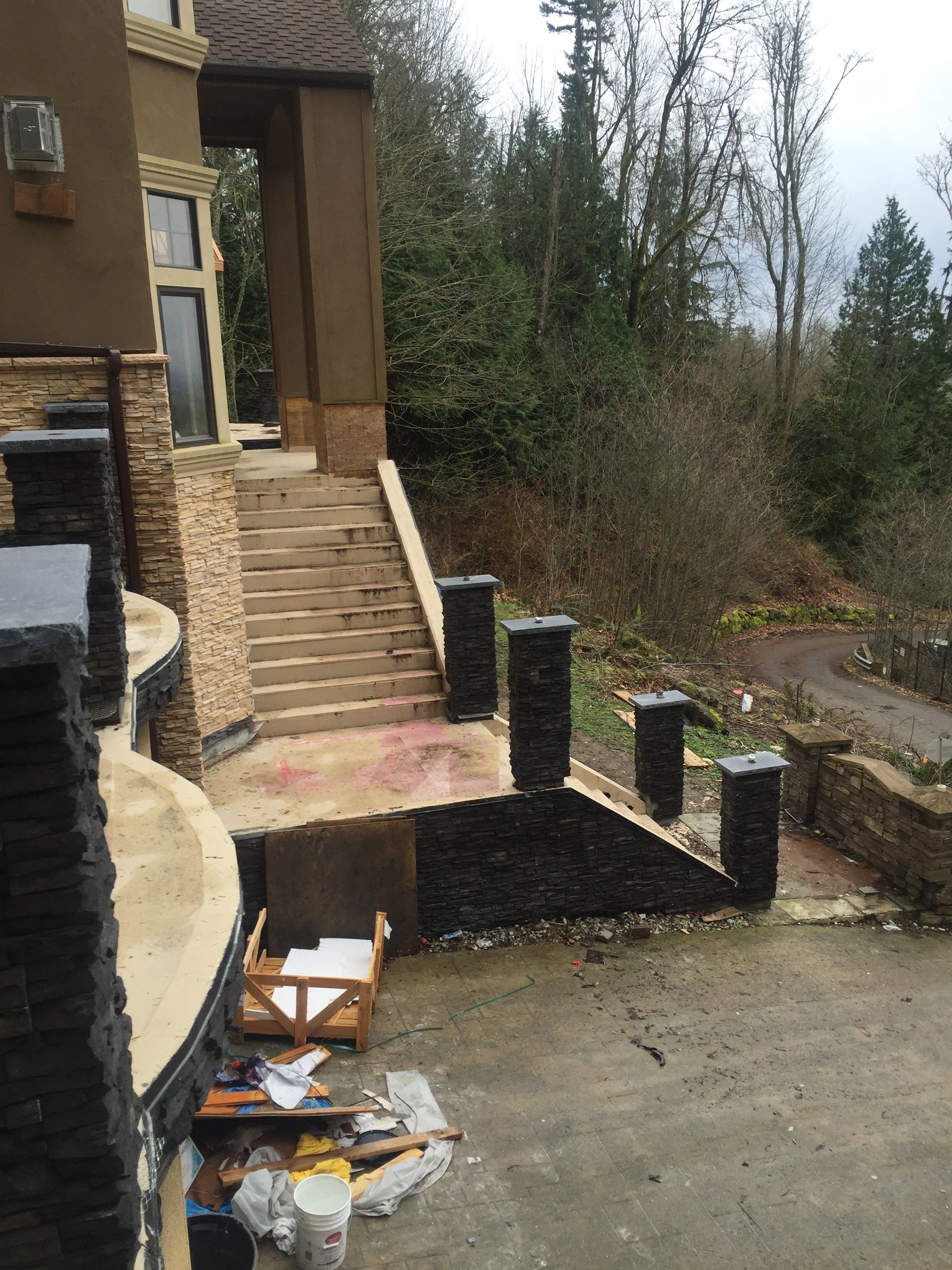 Asphalt Driveway and Stamped Concrete Patio Finish  by Jireh Asphalt & Concrete Inc 