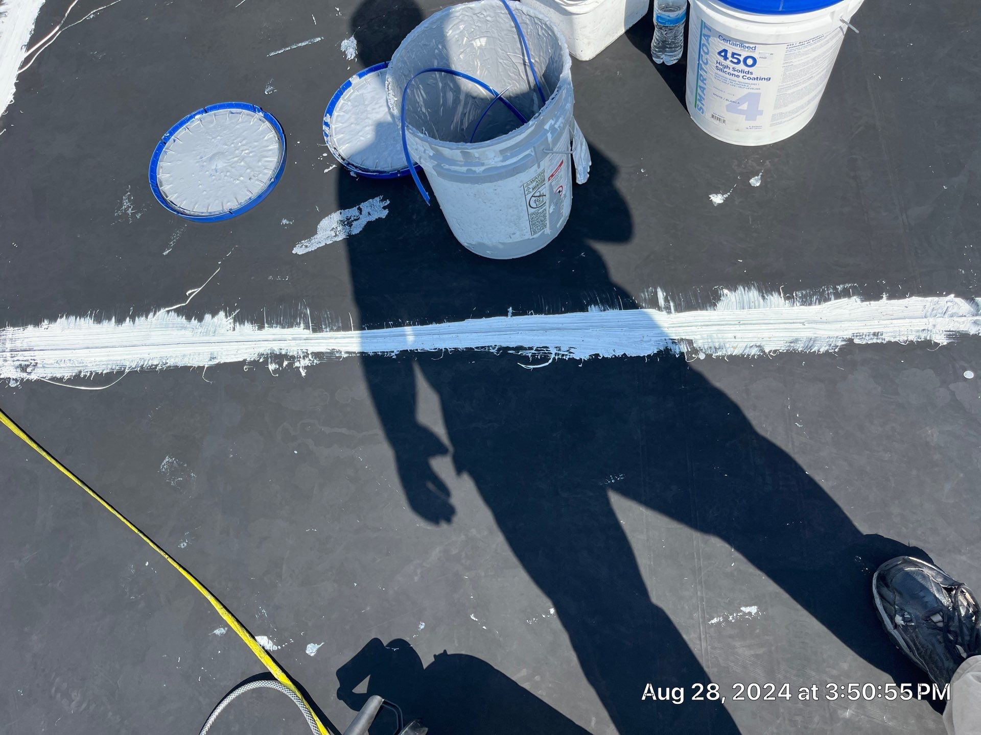 Commercial Roofing Installation using smartcoat Roof coating by Fahey Roofing + Contracting