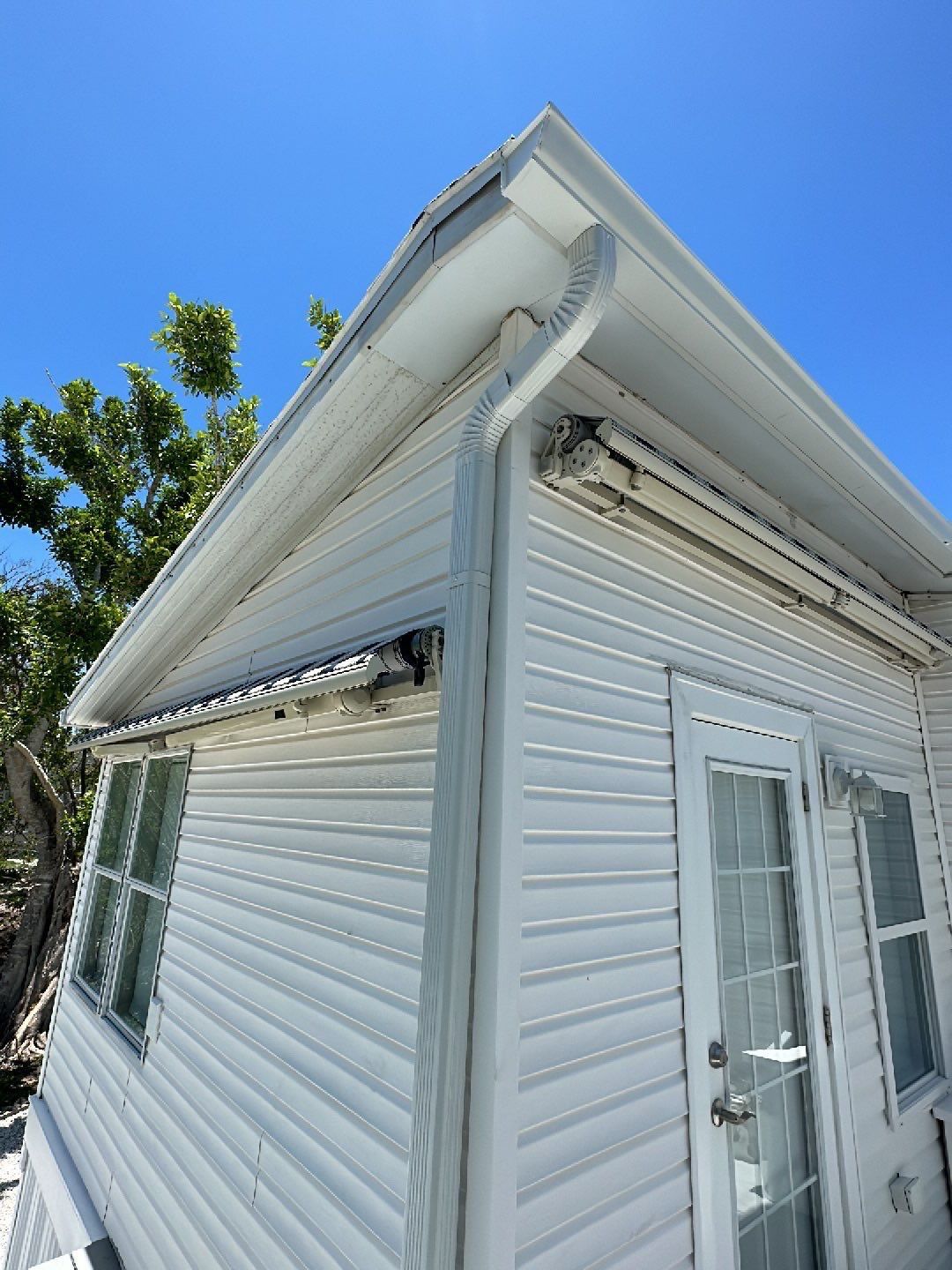 Downspout Installation using Charcoal Grey in Sanibel FL by Gutter Professors