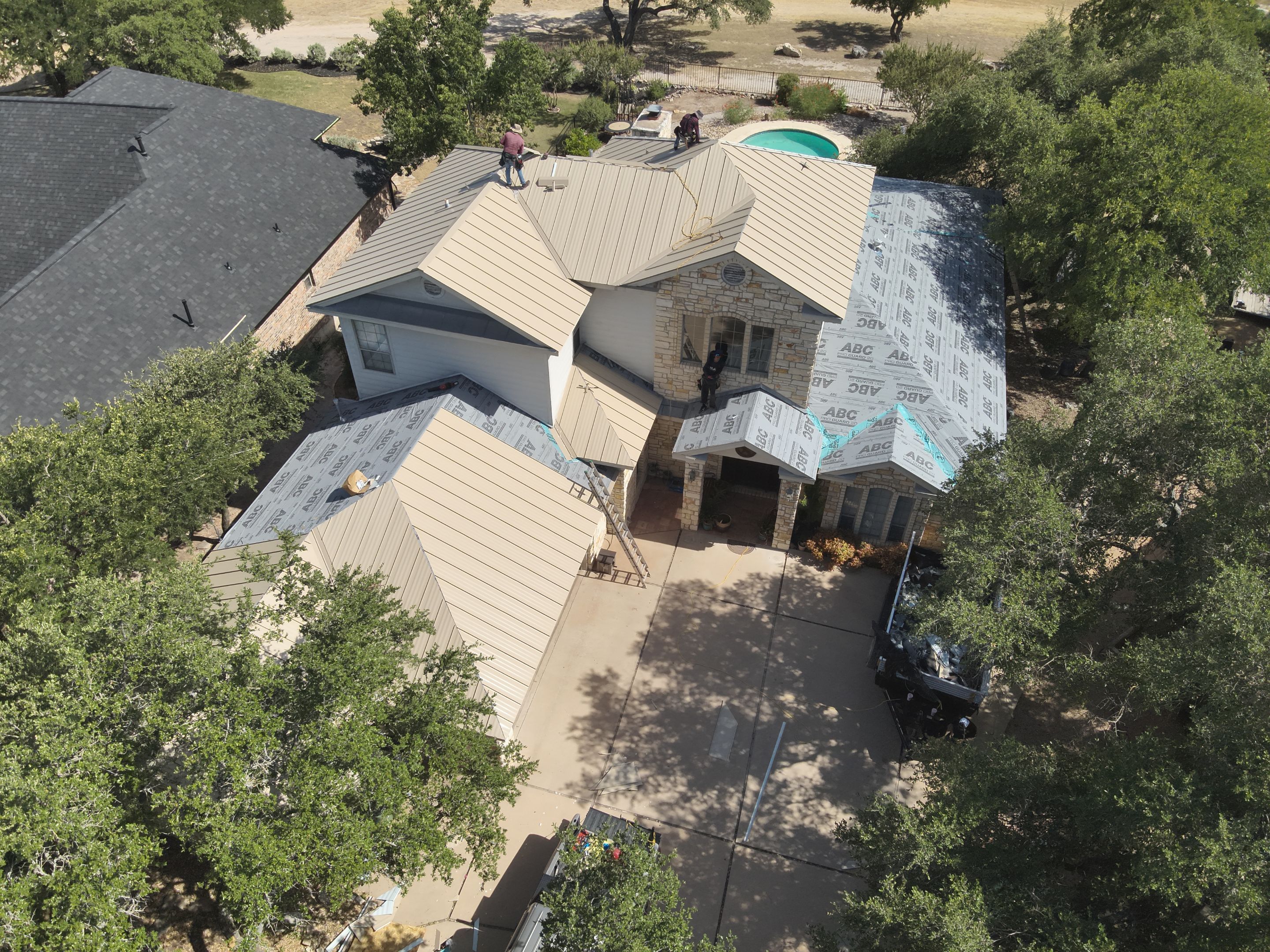 Residential Roof Replacement using 24 GA Double-Lock - Surrey Beige by Action Exteriors Austin