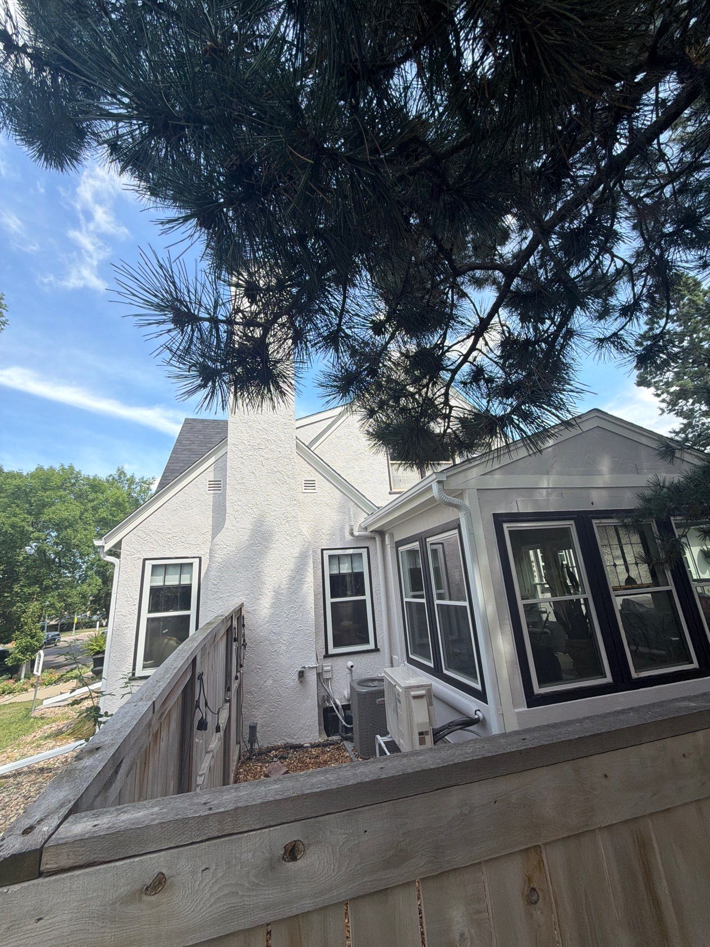 Exterior Stucco Painting and Trim Refresh in Sioux Falls by Select Painting, Coatings & Garage Cabinets