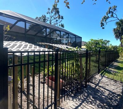 Aluminum Fence Installation using Black 3 Rail Aluminum Fence