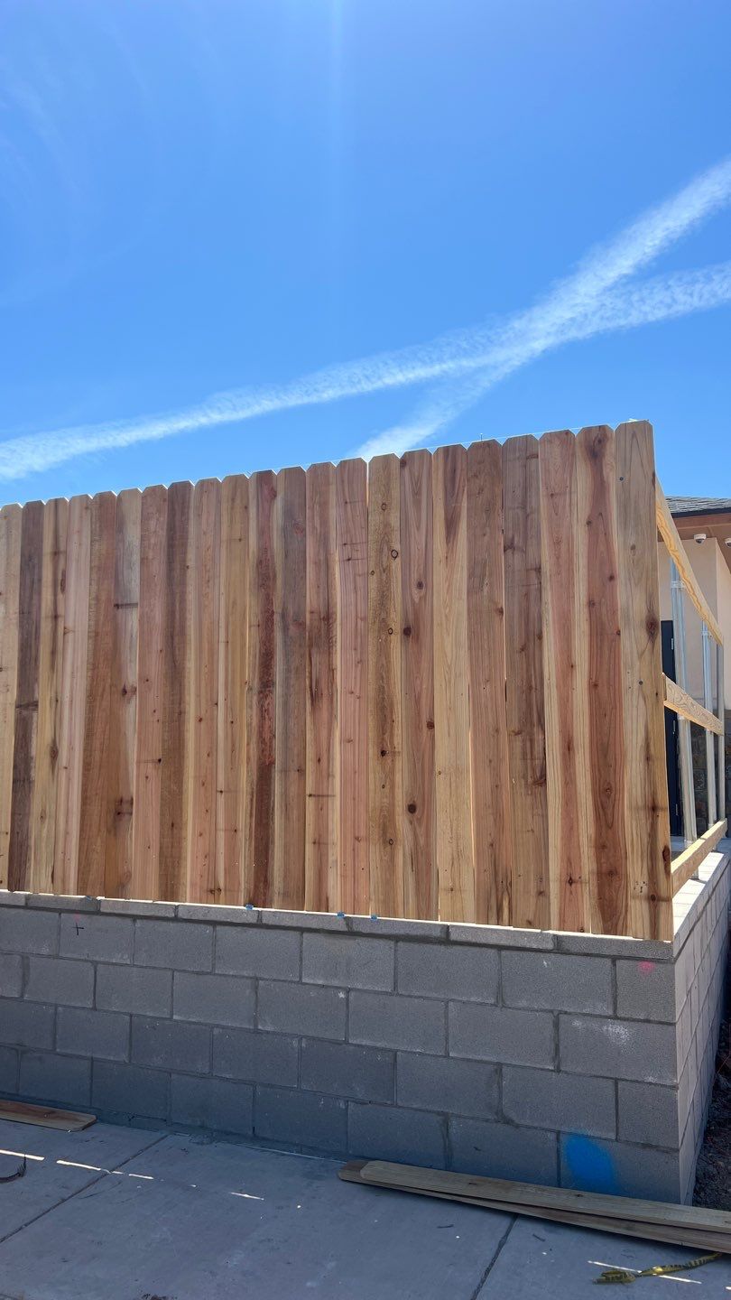 Cedar Fence using Cedar Pickets and Metal Poles by Clays Services Inc