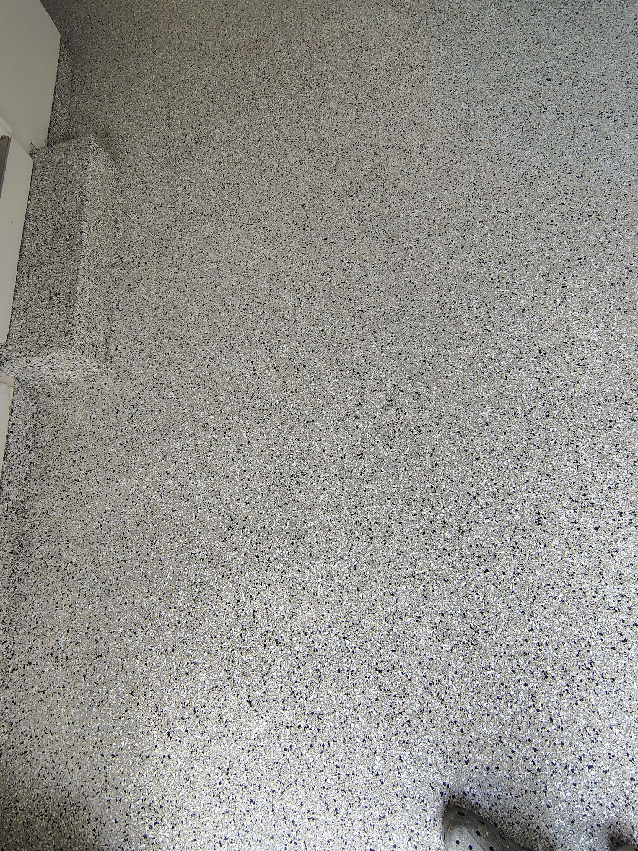 Full-Flake Epoxy Garage Floor Coating Installation in Sioux Falls by Select Painting, Coatings & Garage Cabinets