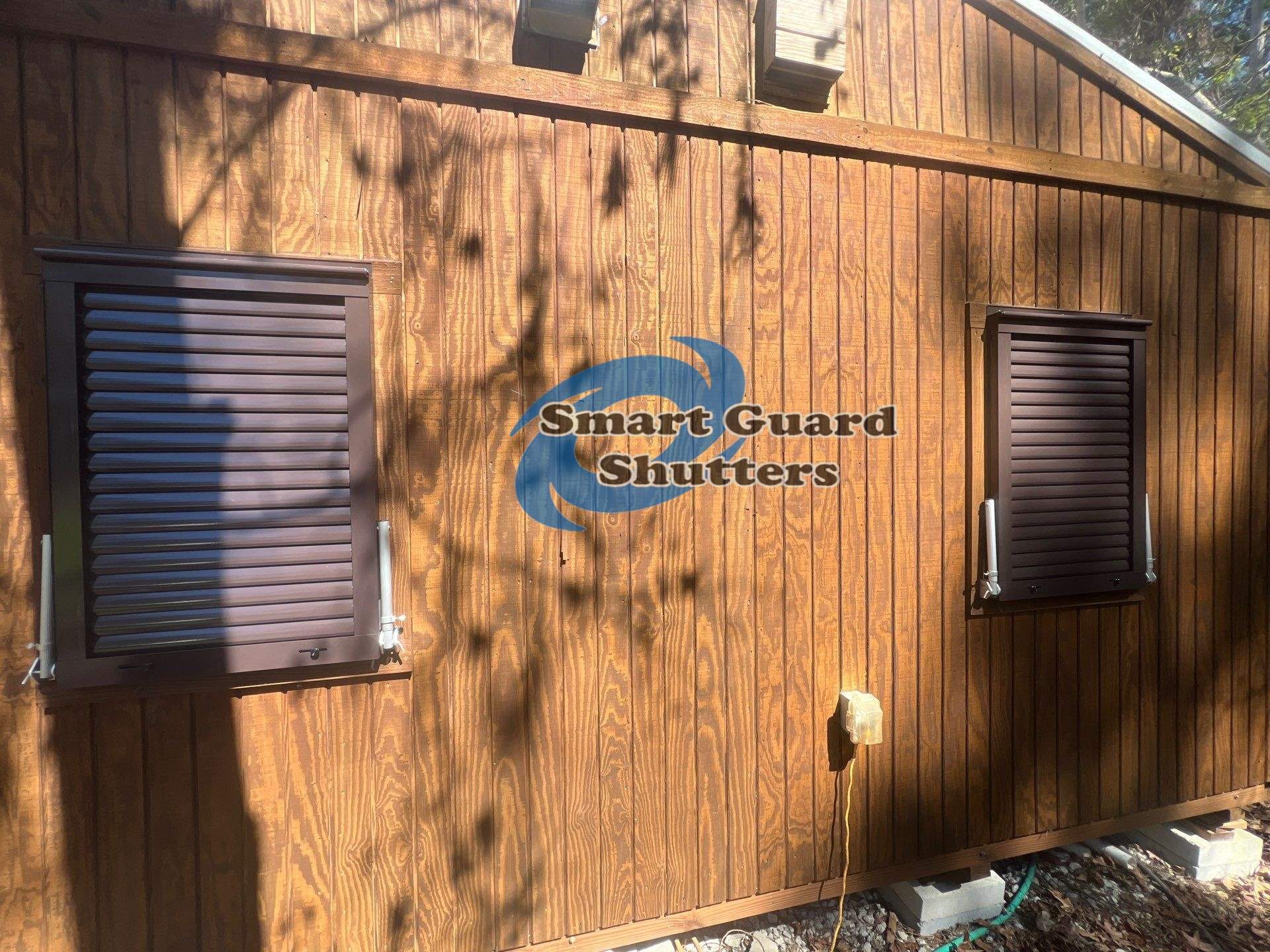 Hurricane Protection in Bronze/Grey Brown by Smart Guard Shutters