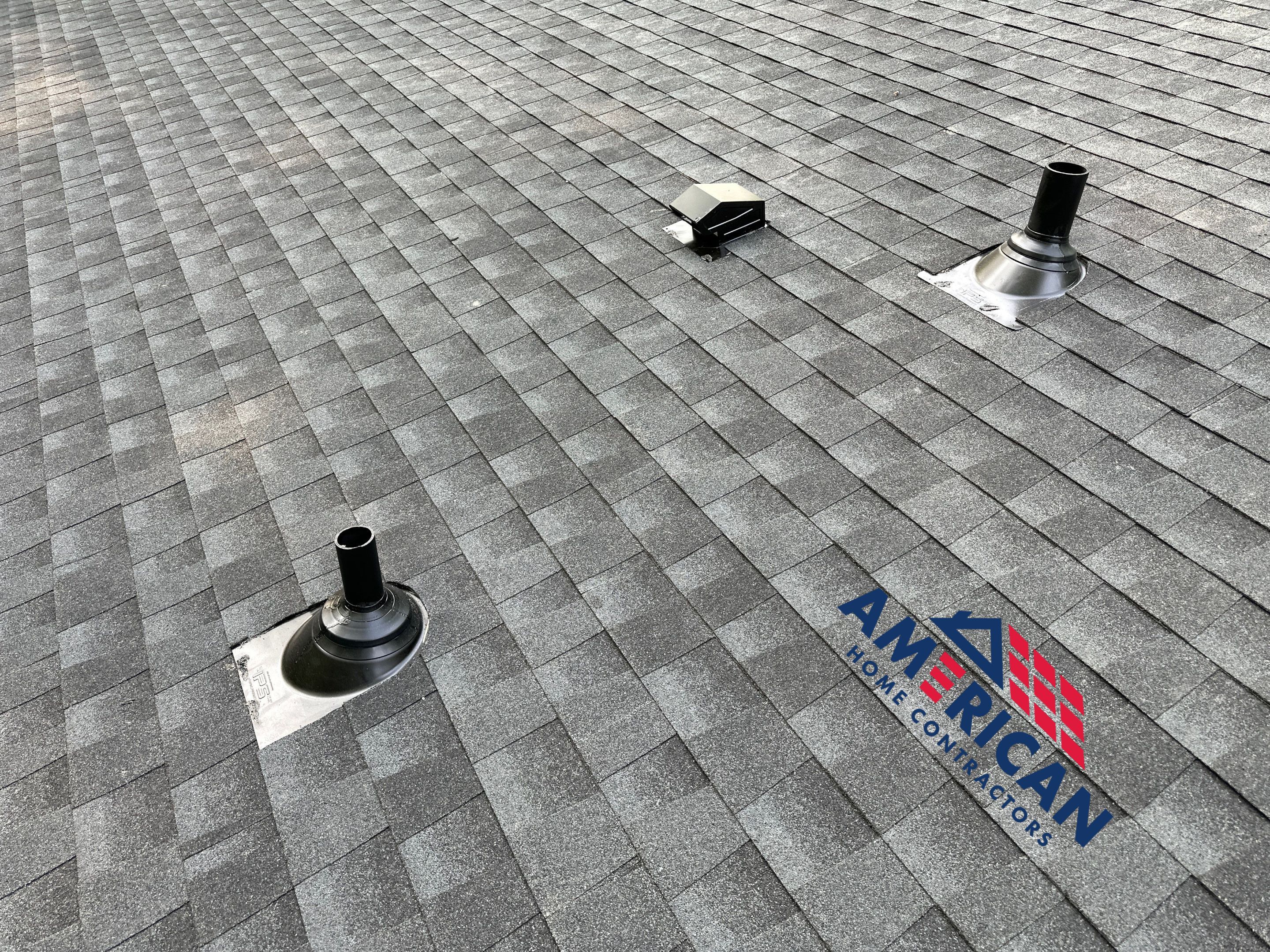 Acorn Deck House Roof Replacement + Skylight Addition by American Home Contractors