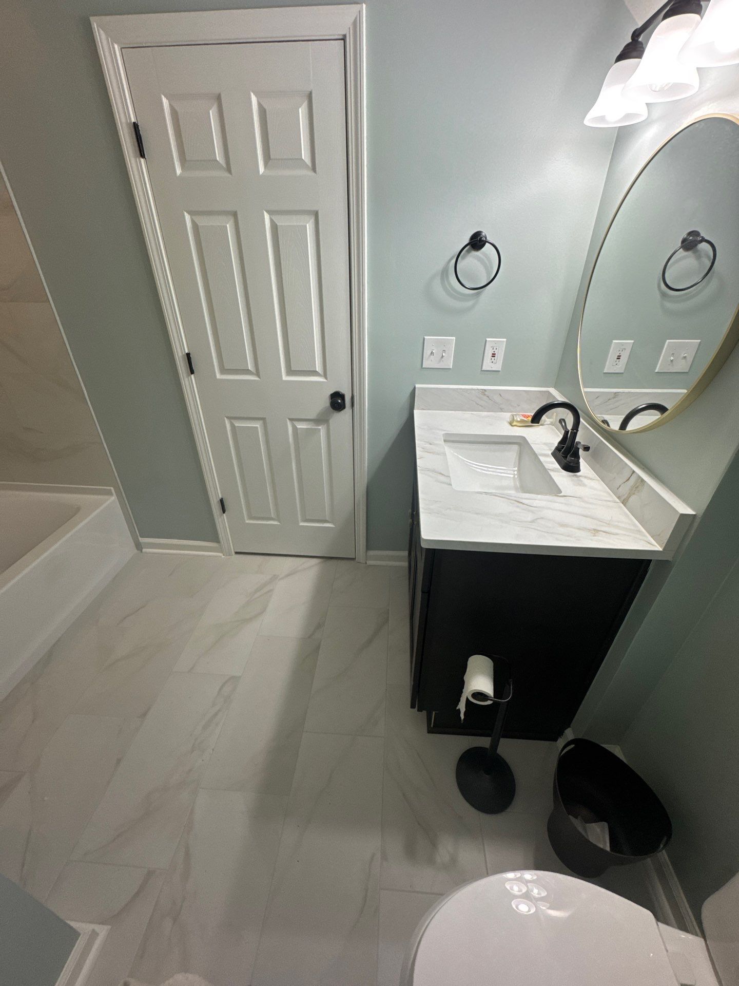 Modern Bathroom Transformation With Marble Patterned Tile in Powder Springs by Swift Home Renovations