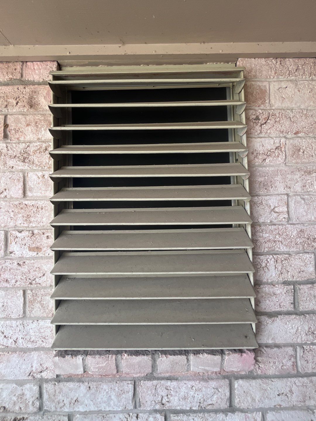 Colored Vinyl Windows to blend into brick by Bayfront Roofing and Construction
