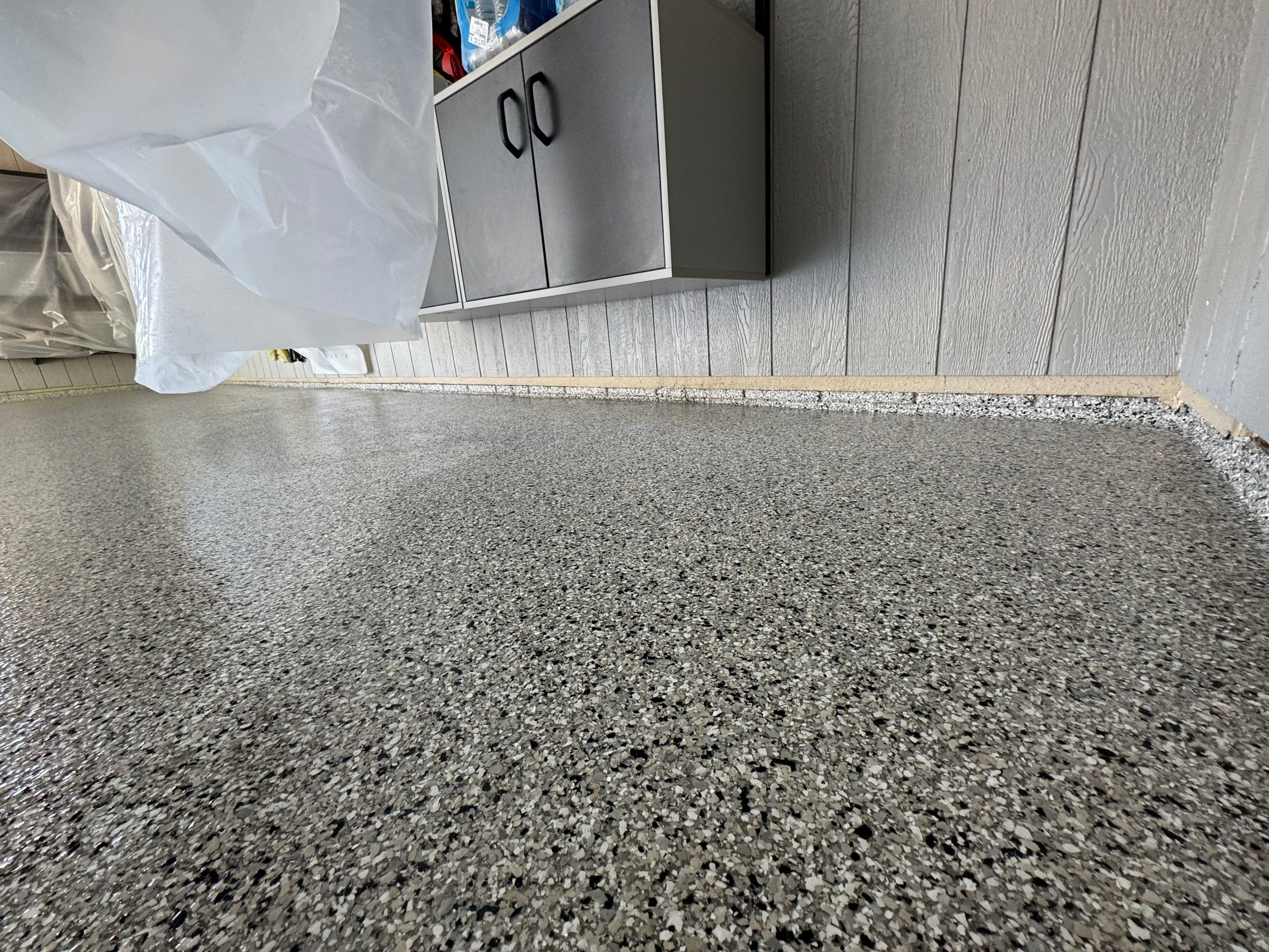 High-Gloss Grey Epoxy Floor Coating for Inwood Garage by Select Painting, Coatings & Garage Cabinets